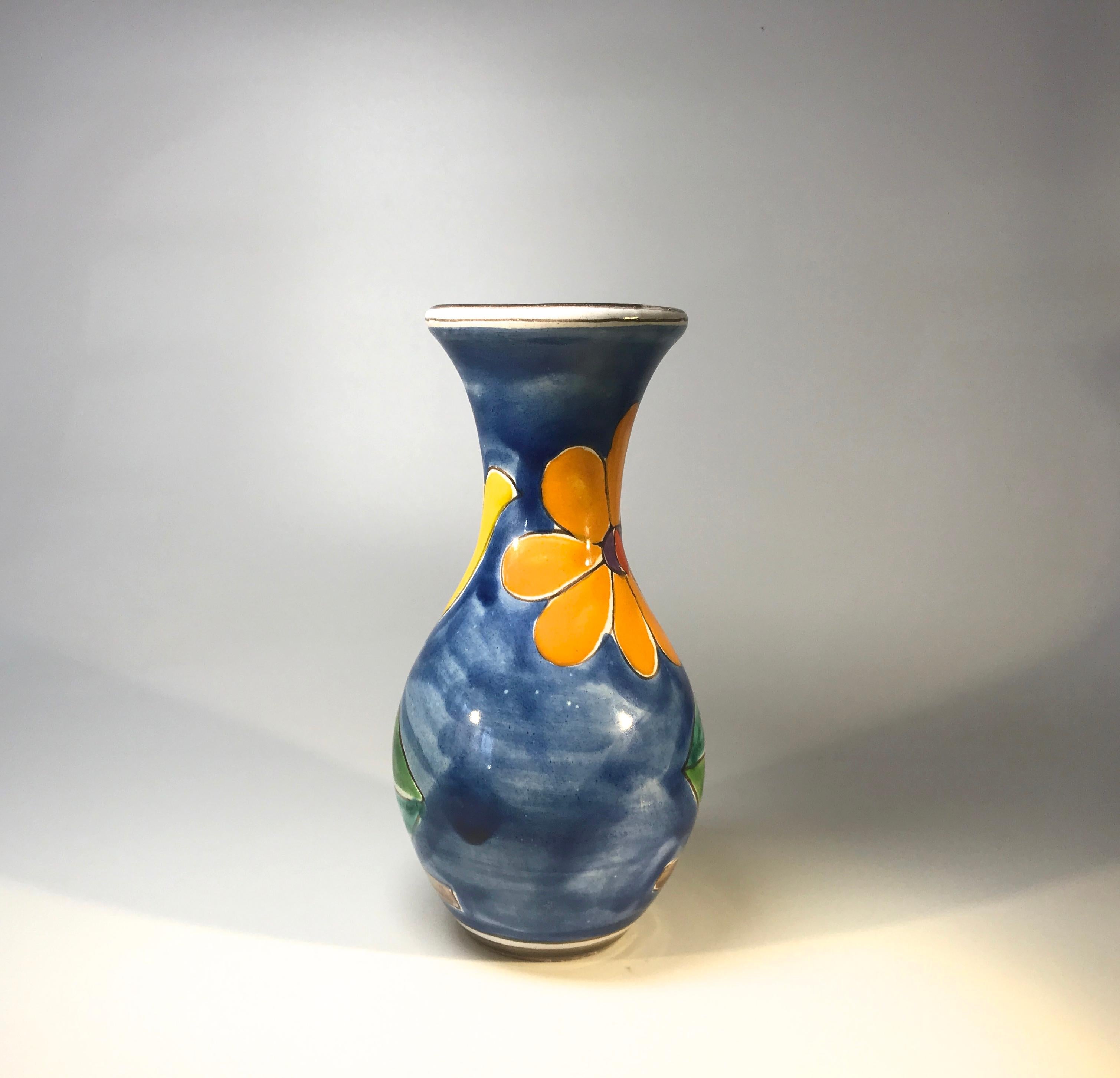 DeSimone of Italy, tall shaped ceramic vase hand decorated with brightly colored orange and yellow flowers
A delightfully cheerful vase from DeSimone,
Circa 1960s
Signed DeSimone, Italy
Measures: Height 7 inch, diameter 3.5 inch
Very good condition