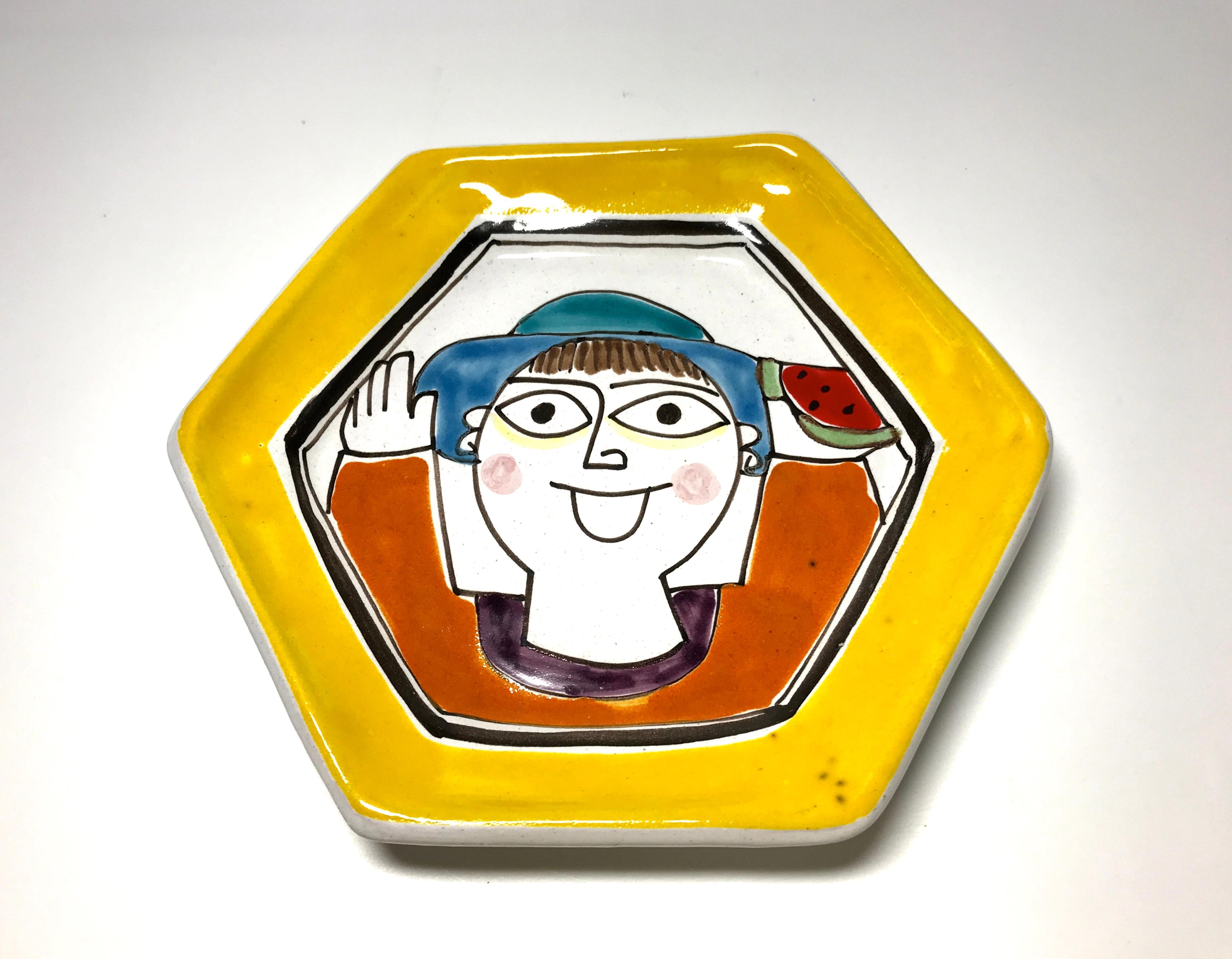 DeSimone of Italy, happy face hexagonal yellow ceramic tea plate
A charming little plate from DeSimone
circa 1960s
Signed DeSimone, Italy on reverse
Measures: Diameter 6 inch, height 0.5 inch
Good condition and vibrant colors. Minor under glaze