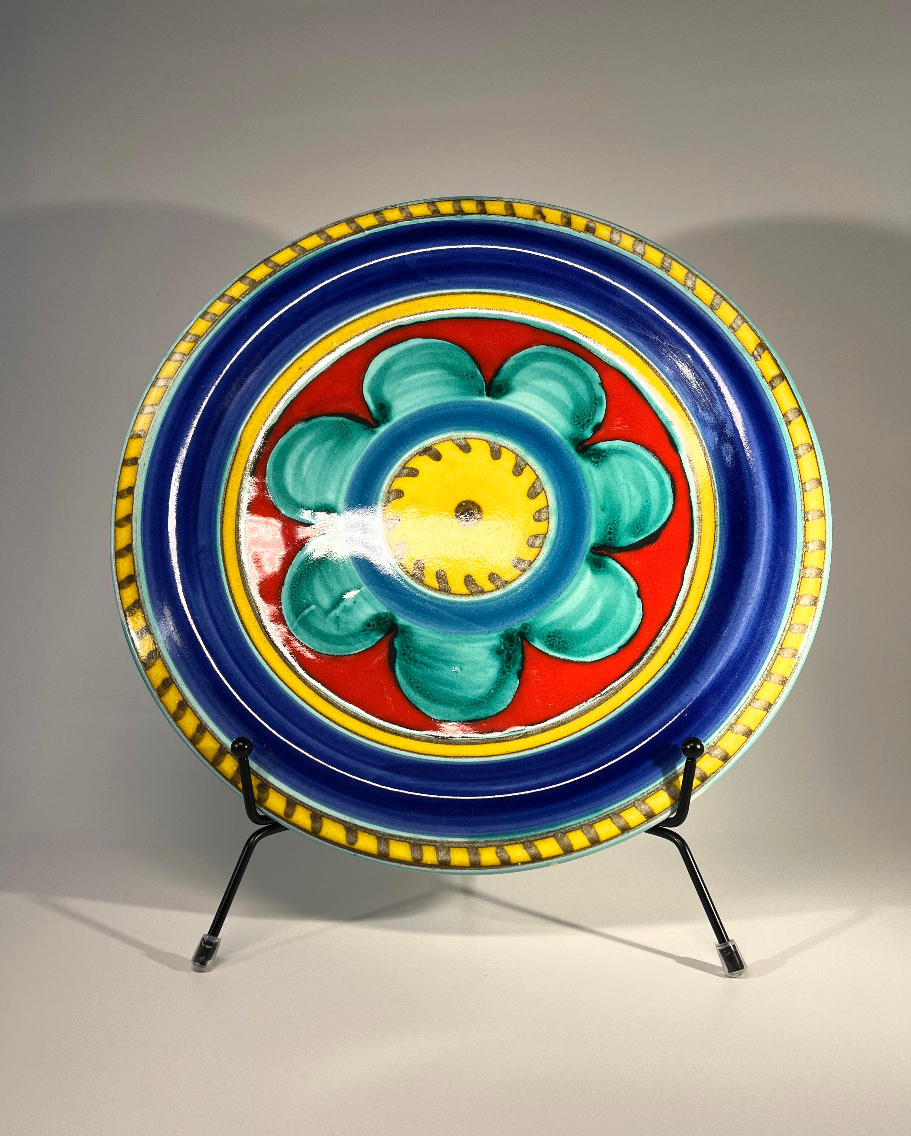 Colorful hand painted, large ceramic plate by DeSimone, Italy
Signed DeSimone, Italy to reverse,
circa 1960s
Measures: Height 1 inch, diameter 10 inch
In very good condition.