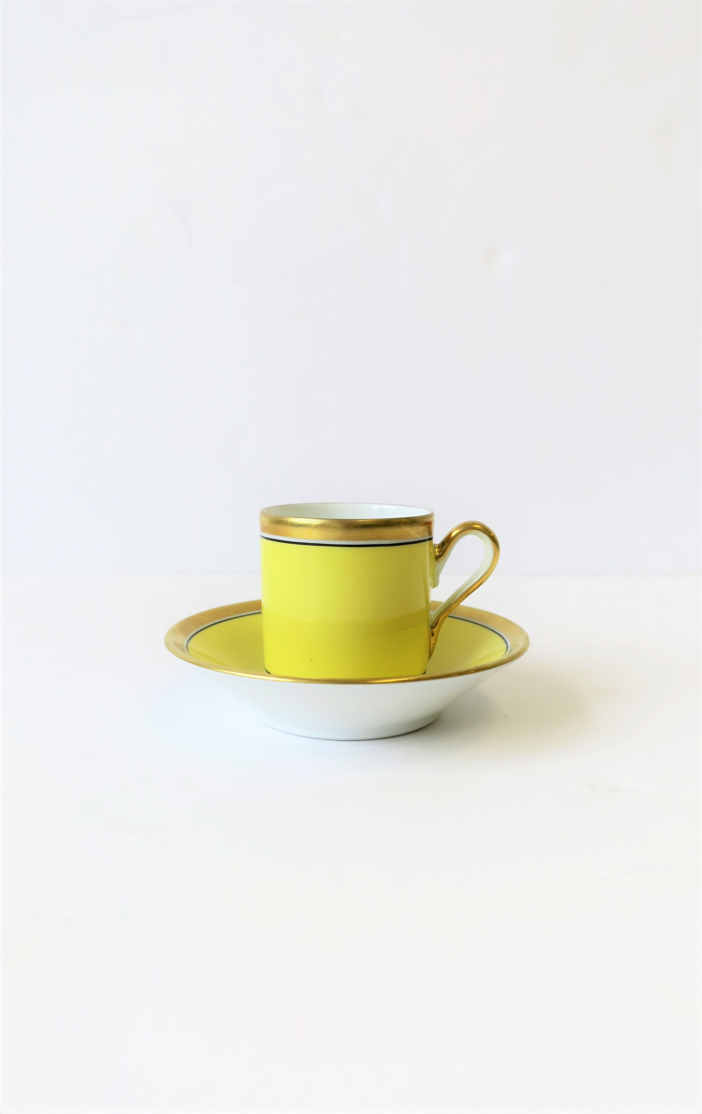 A beautiful yellow midcentury Italian espresso coffee or tea demitasse cup and saucer by designer Richard Ginori with decorative urn detail. Colors include: yellow, gold, white and black. With maker's mark on bottom as show in image #6. Set is in
