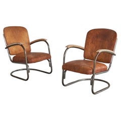 Desirable Paar röhrenförmige Loungesessel aus patiniertem cognacfarbenem Leder, 1930er Jahre