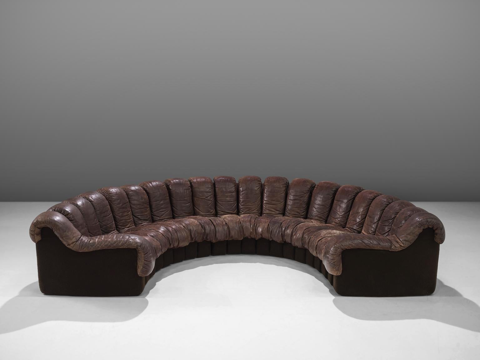 De Sede ‘Snake’ DS-600, in dark brown leather, Switzerland, 1972. 

De Sede 'Non Stop' sectional sofa containing 20 pieces in original dark brown leather, of which 18 center pieces and two higher armrests. Any number of pieces can be zipped