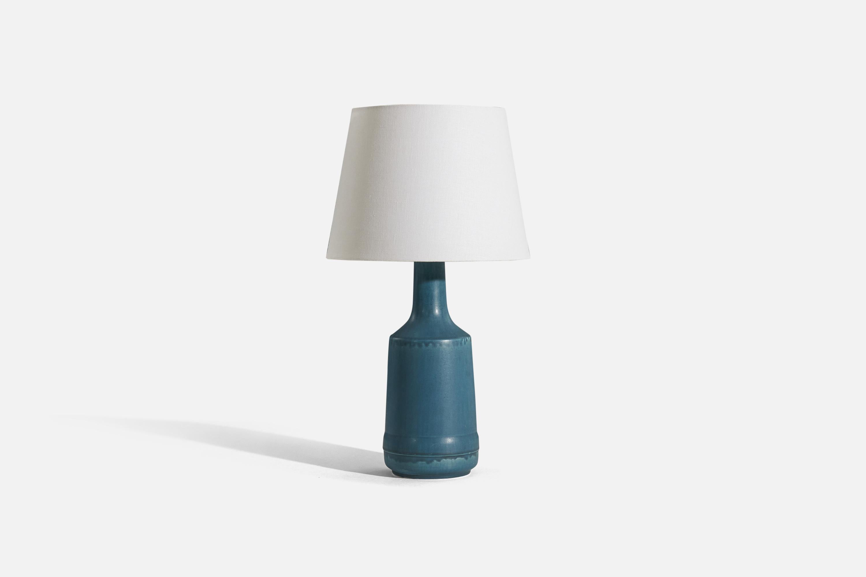 A blue, glazed stoneware table lamp designed and produced by Desiree Stentøj, Denmark, 1960s. 

Sold without lampshade. 
Dimensions of Lamp (inches) : 16.125 x  5.5 x 5.5 (H x W x D)
Dimensions of Shade (inches) : 9 x 12.125 x 9.0625 (T x B x
