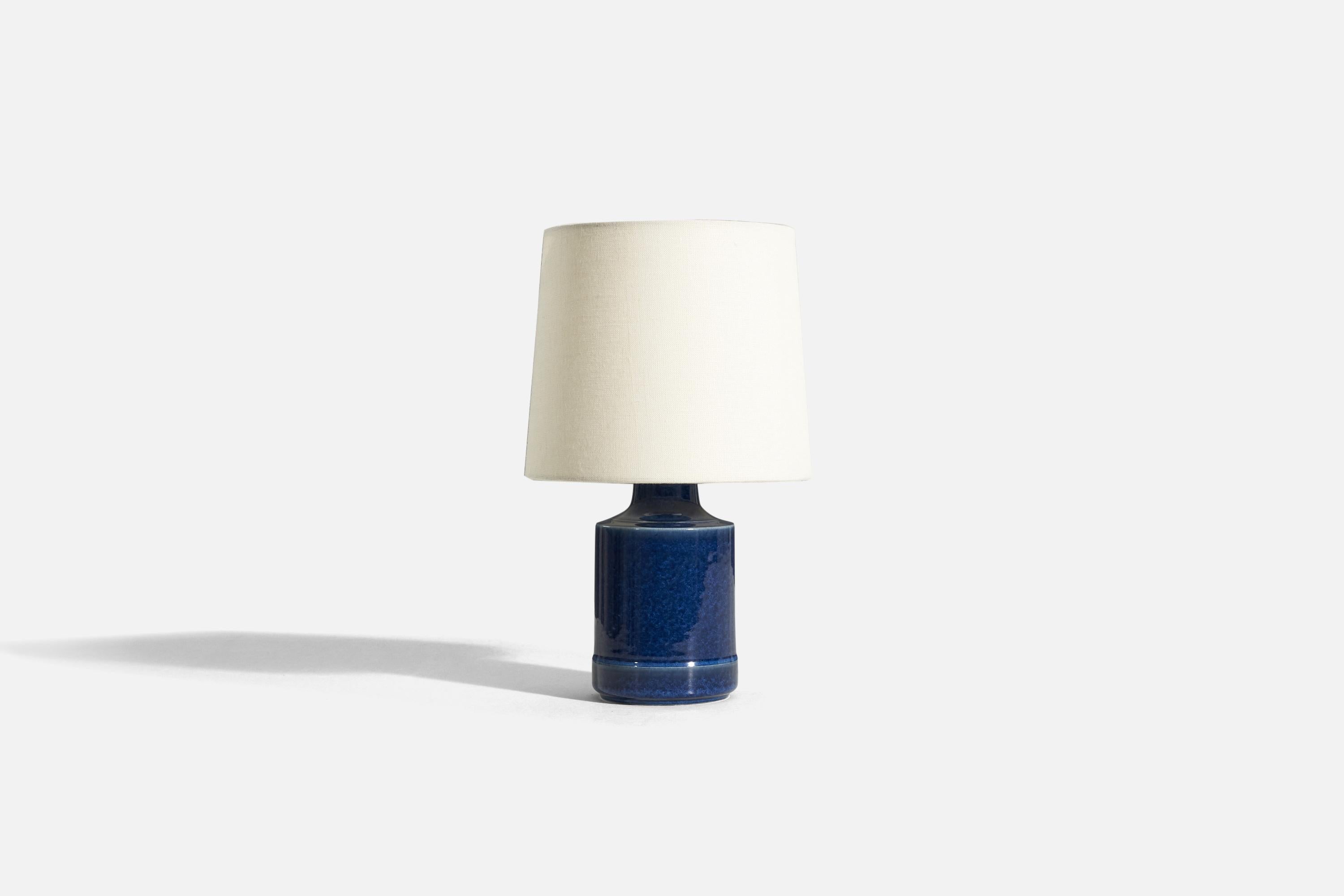 A blue-glazed stoneware table lamp, designed and produced by Desiree Stentøj, Denmark, 1970s. 

Sold without lampshade. 
Dimensions of Lamp (inches) : 9.125 x 4.125 x 4.125 (H x W x D)
Dimensions of Shade (inches) : 7 x 8 x 7 (T x B x