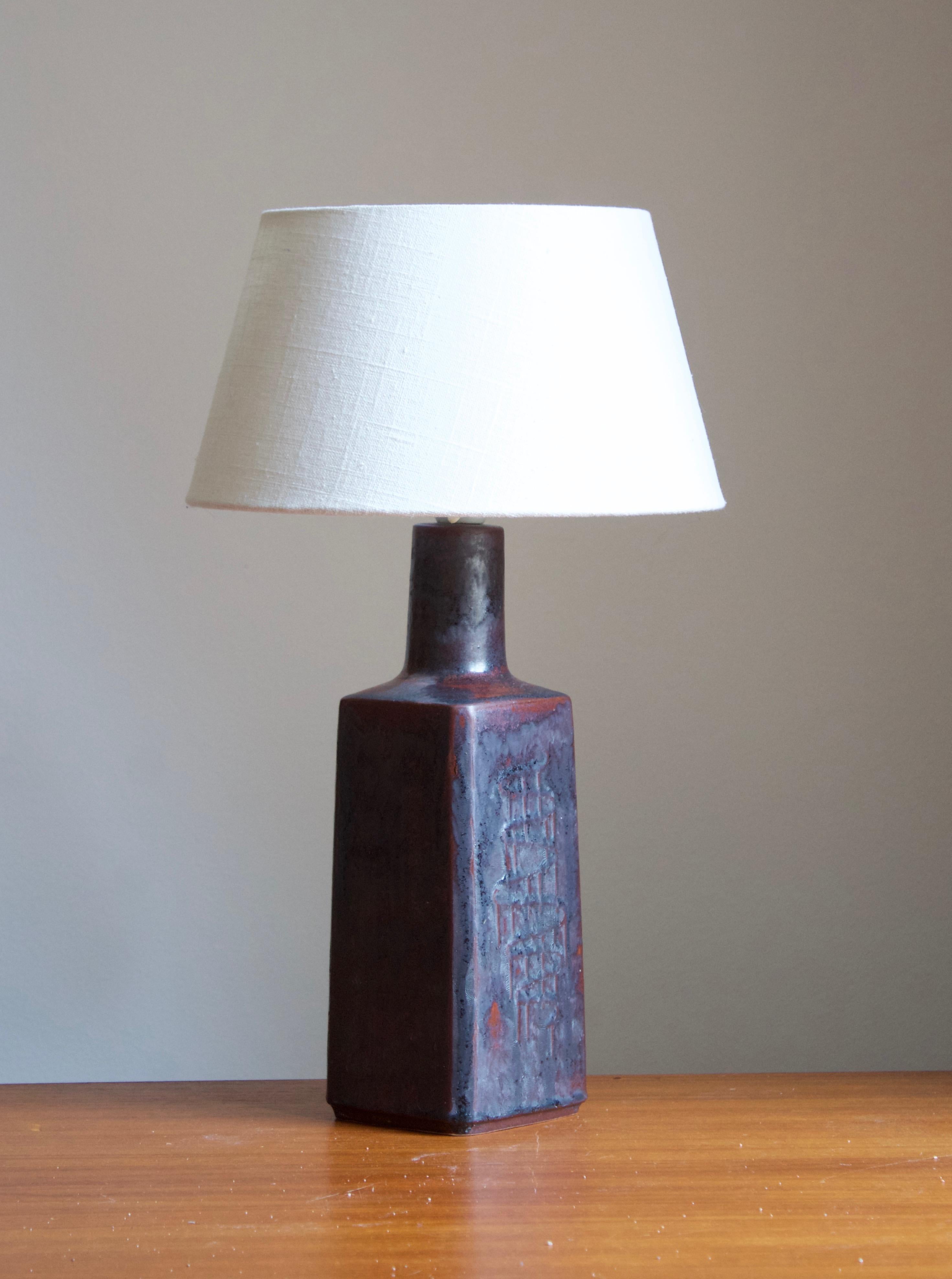 A table lamp, designed and produced by Desiree Stentøj, Denmark, 1960s. stamped.

Sold without lampshade. Stated dimensions exclude lampshade. Height includes socket.

Glaze features red-grey colors.
 
 