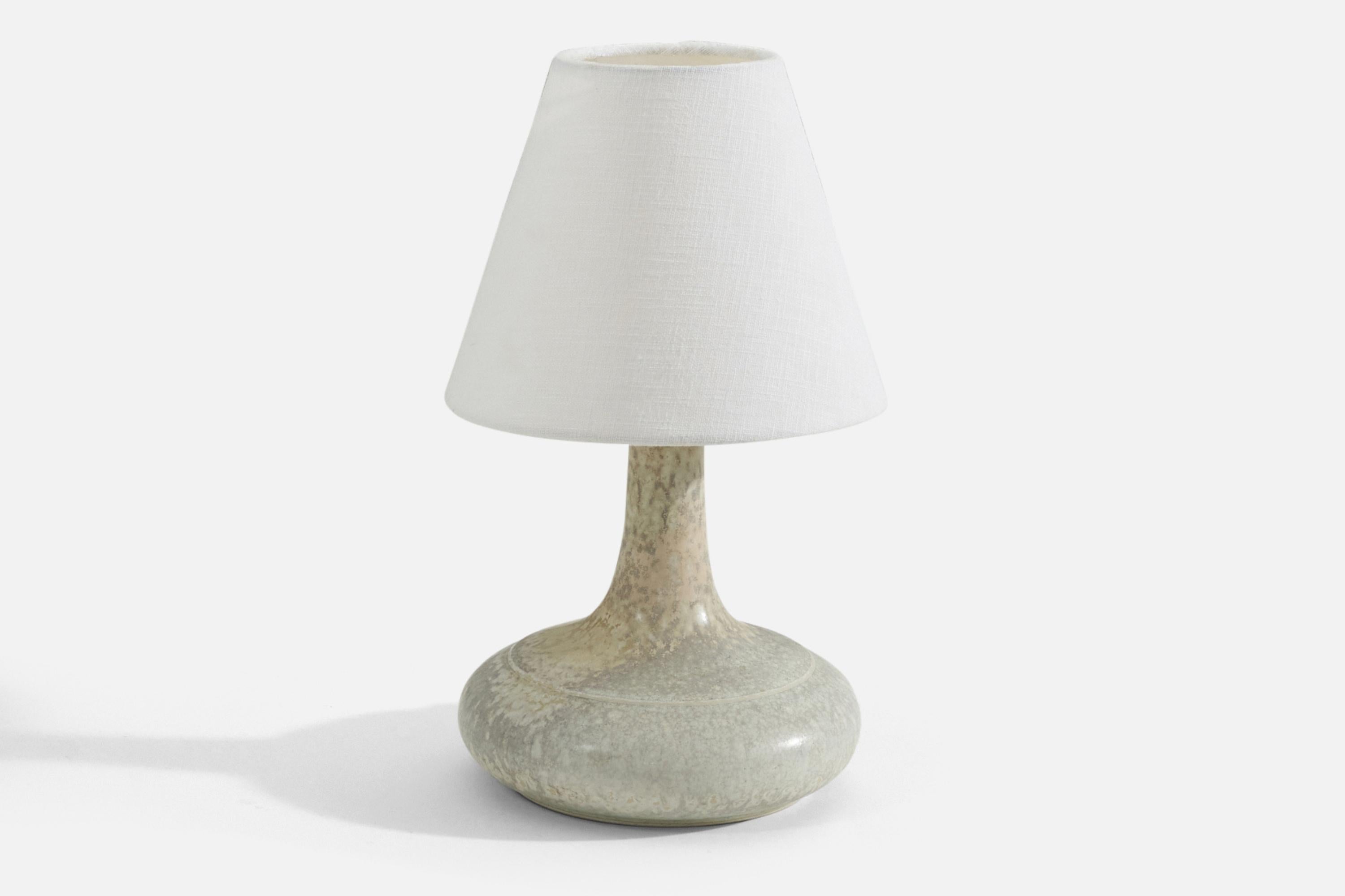 A gray glazed earthenware table lamp designed and produced by Desiree Stentøj, Denmark, 1960s. stamped on bottom. 

Sold without lampshade. Stated dimensions exclude lampshade. Height includes socket. 

Shade : 4 x 8 x 6.75
Lamp with shade :