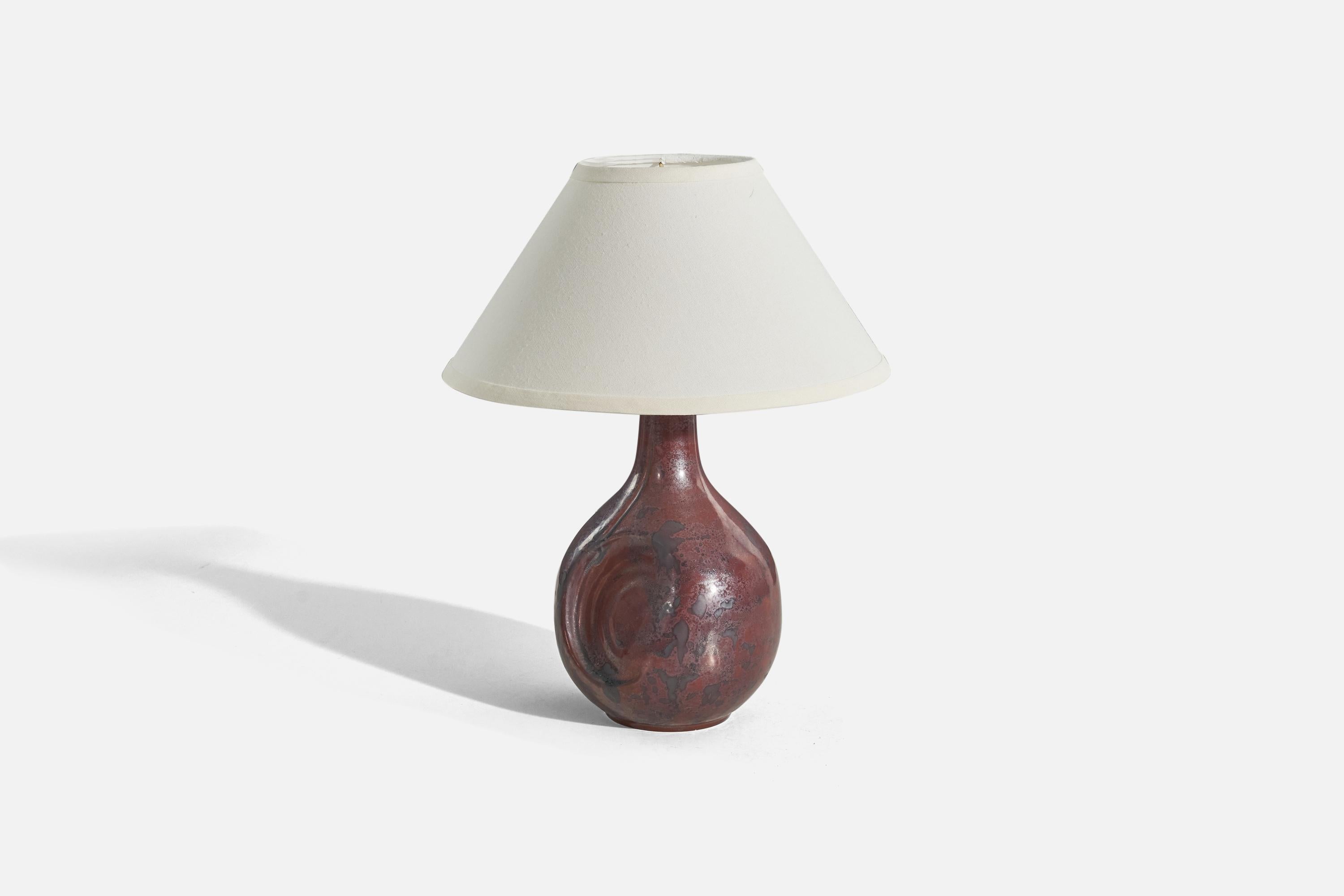A red, glazed stoneware table lamp designed and produced by Desiree Stentøj, Denmark, 1960s. 

Sold without lampshade. 
Dimensions of Lamp (inches) : 14.81 x 7.5 x 7.25 (Height x Width x Depth)
Dimensions of Shade (inches) : 5.75 x 14 x 8 (Top