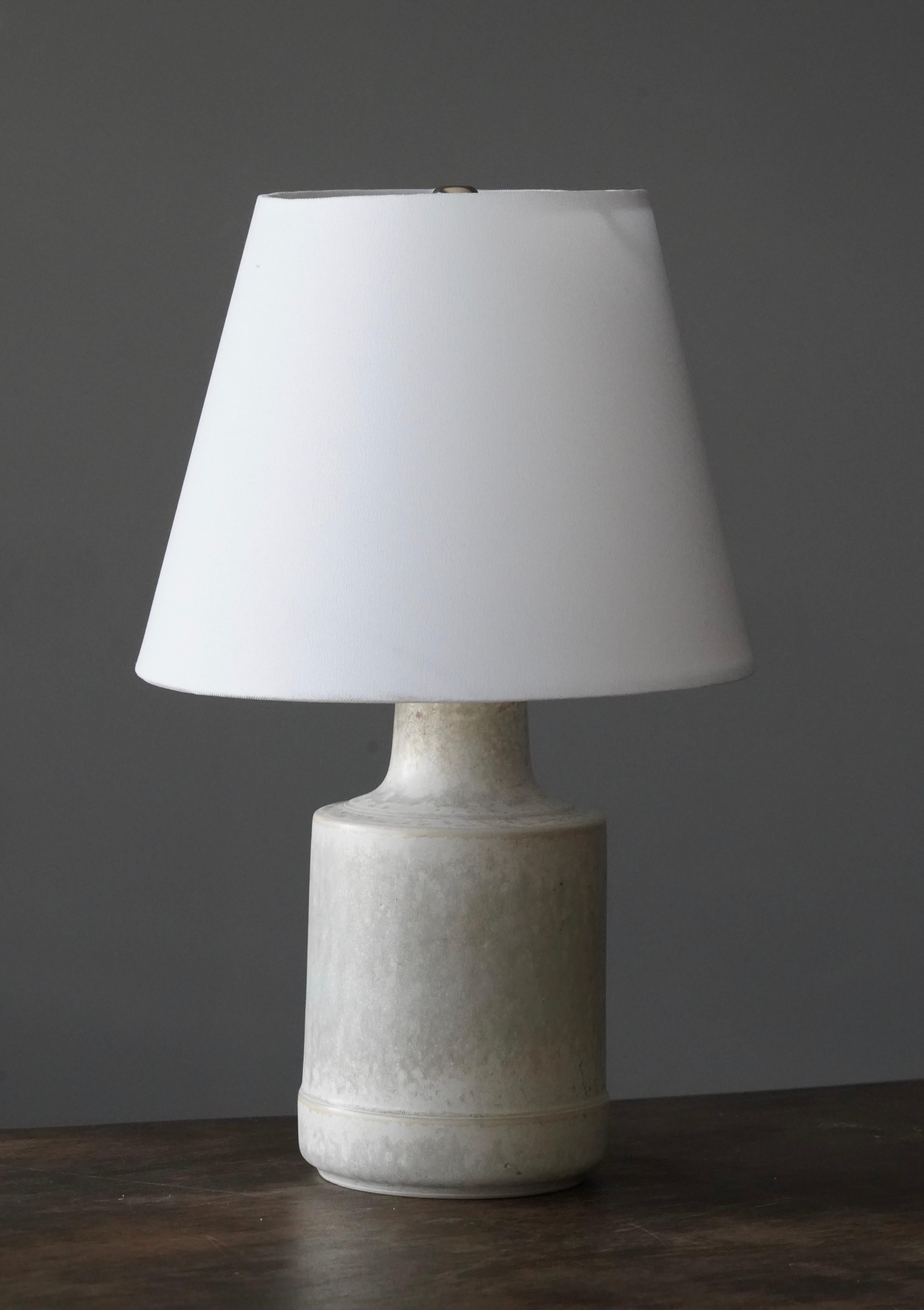 A table lamp, designed and produced by Desiree Stentøj, Denmark, 1960s. stamped.

Sold without lampshade. Stated dimensions exclude lampshade. Height includes socket. 

Dimensions with shade: height is 13.5 inches, width is 8.25