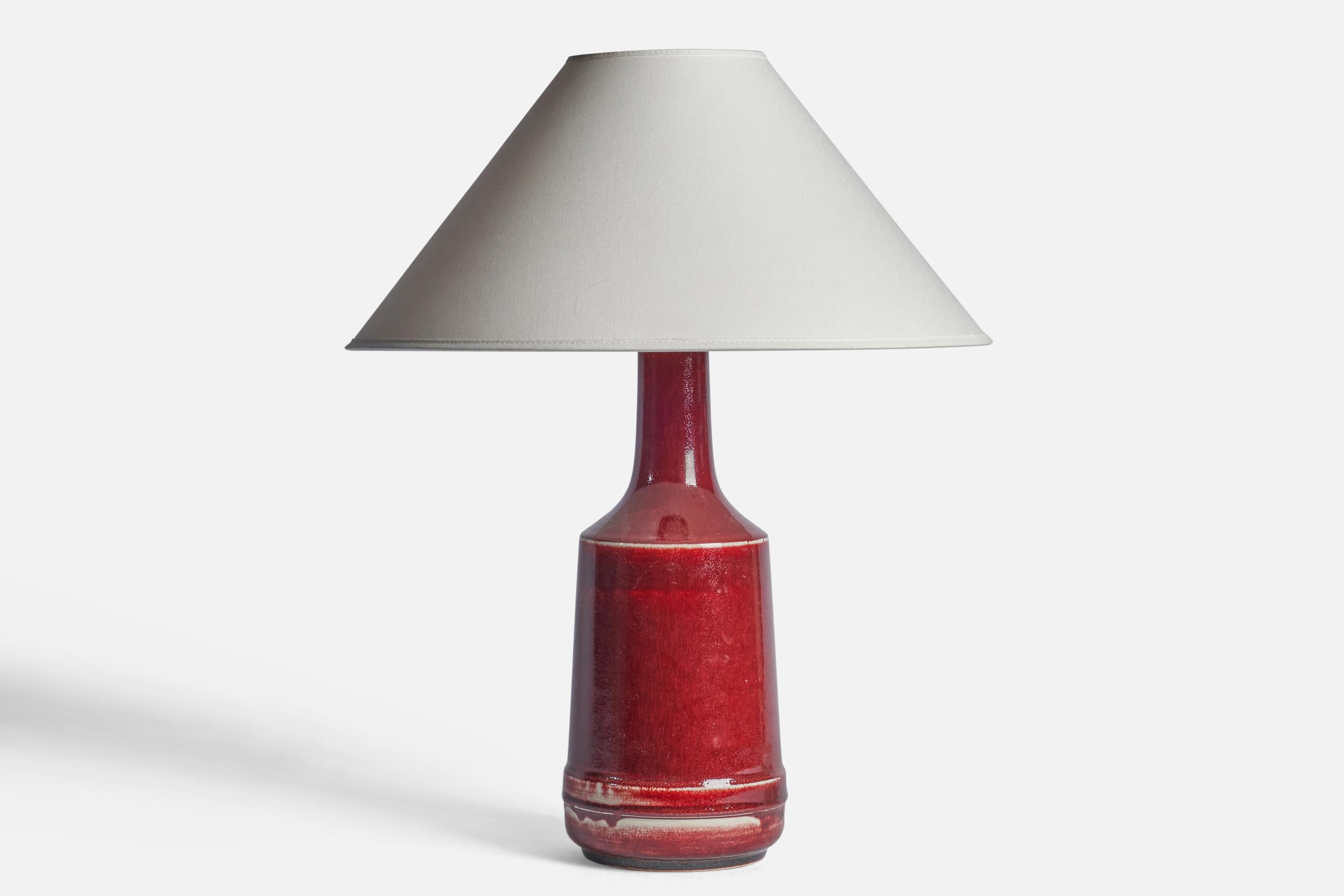 A red-glazed stoneware table lamp designed and produced by Desiree, Denmark, 1960s.

Dimensions of Lamp (inches): 15.25