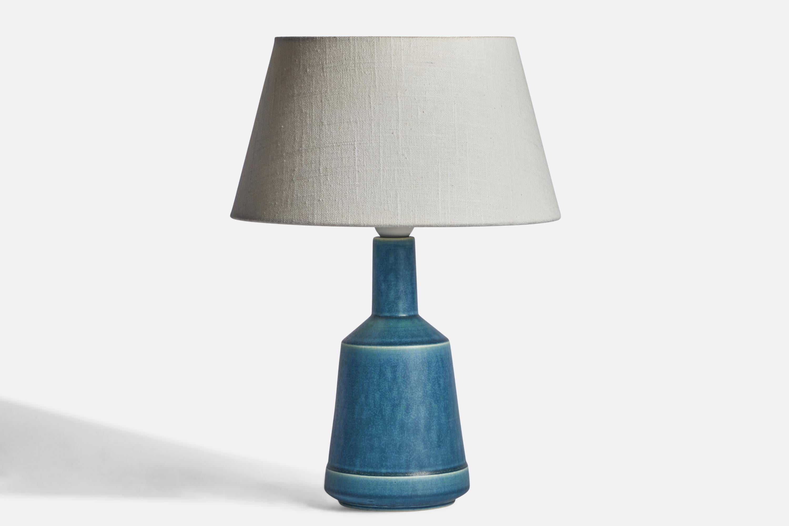 A blue-glazed stoneware table lamp designed and produced by Desiree, Denmark, 1960s.

Dimensions of Lamp (inches): 11.3” H x 4.5” Diameter
Dimensions of Shade (inches): 7” Top Diameter x 10” Bottom Diameter x 5.5” H 
Dimensions of Lamp with Shade