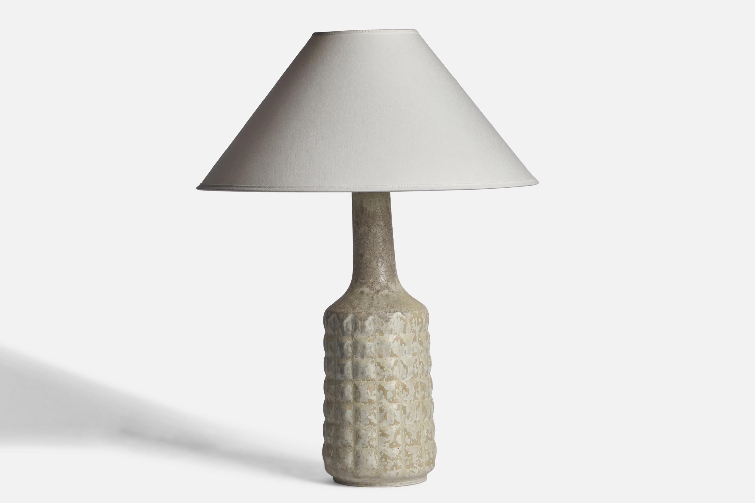 A light grey-glazed stoneware table lamp designed and produced by Desiree, Denmark, c. 1960s.

Dimensions of Lamp (inches): 16.75 H x 5.25” Diameter
Dimensions of Shade (inches): 4.5” Top Diameter x 16” Bottom Diameter x 7.25” H
Dimensions of Lamp