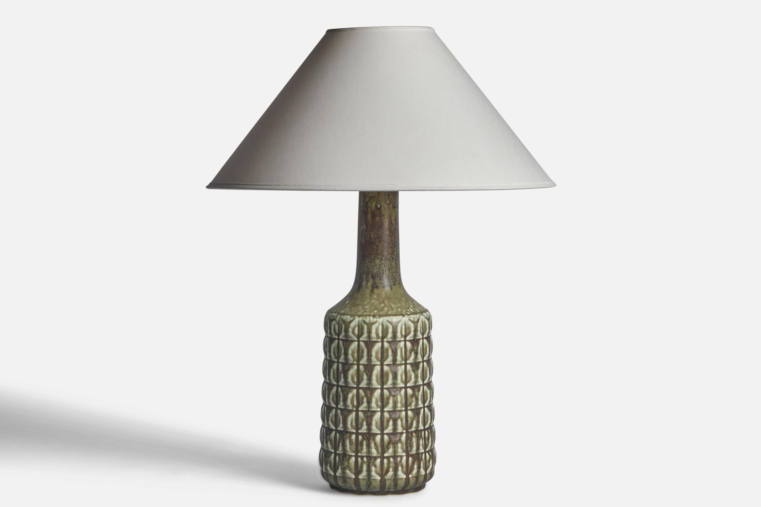 A green-glazed stoneware table lamp designed and produced by Desiree, Denmark, 1960s.

Dimensions of Lamp (inches): 17” H x 5.25” Diameter
Dimensions of Shade (inches): 4.5” Top Diameter x 16” Bottom Diameter x 7.25” H
Dimensions of Lamp with Shade