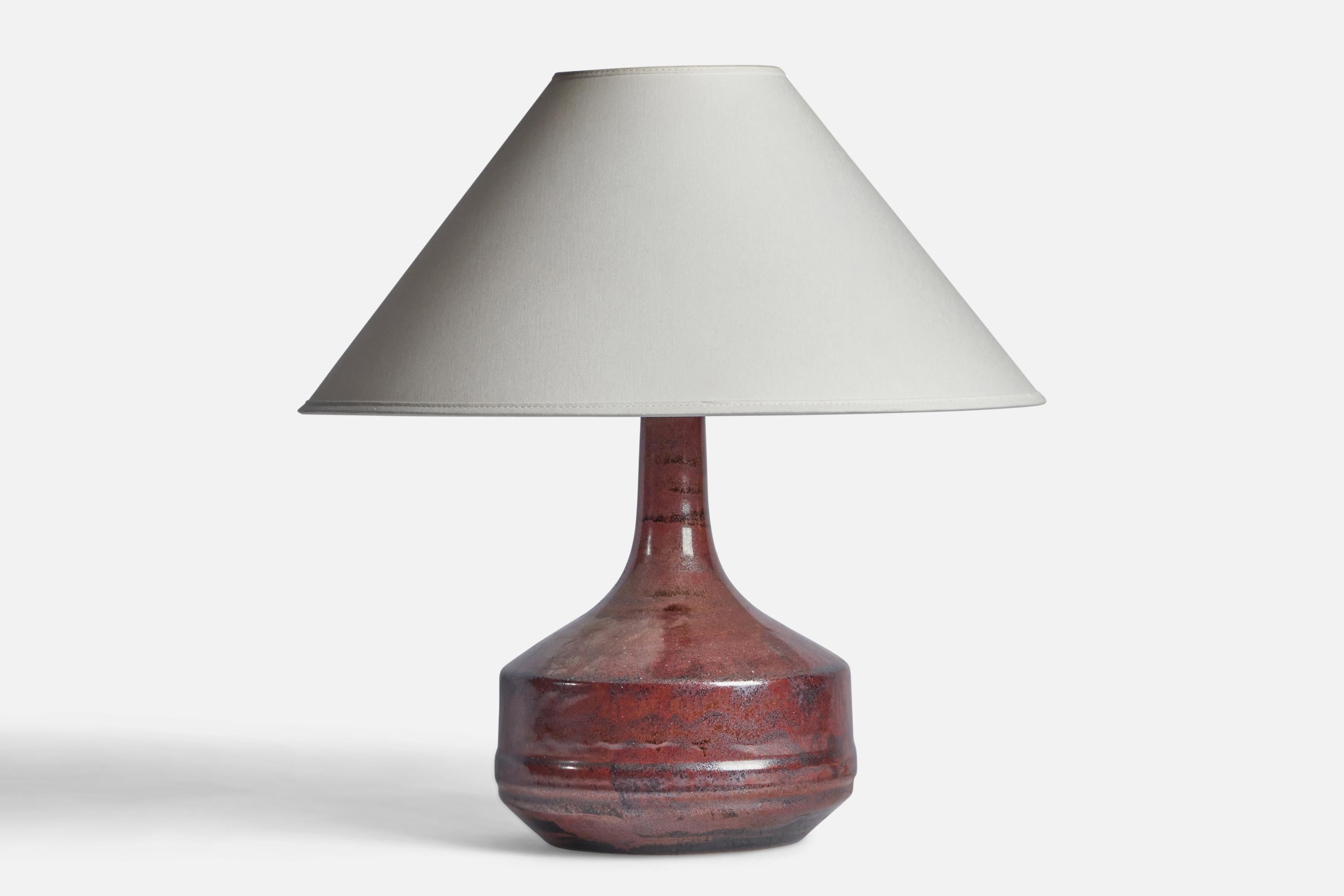 A red-glazed stoneware table lamp designed and produced by Desiree, Denmark, 1960s.

Dimensions of Lamp (inches): 12” H x 7.55” Diameter

Dimensions of Shade (inches): 4.5” Top Diameter x 16” Bottom Diameter x 7.25” H

Dimensions of Lamp with Shade