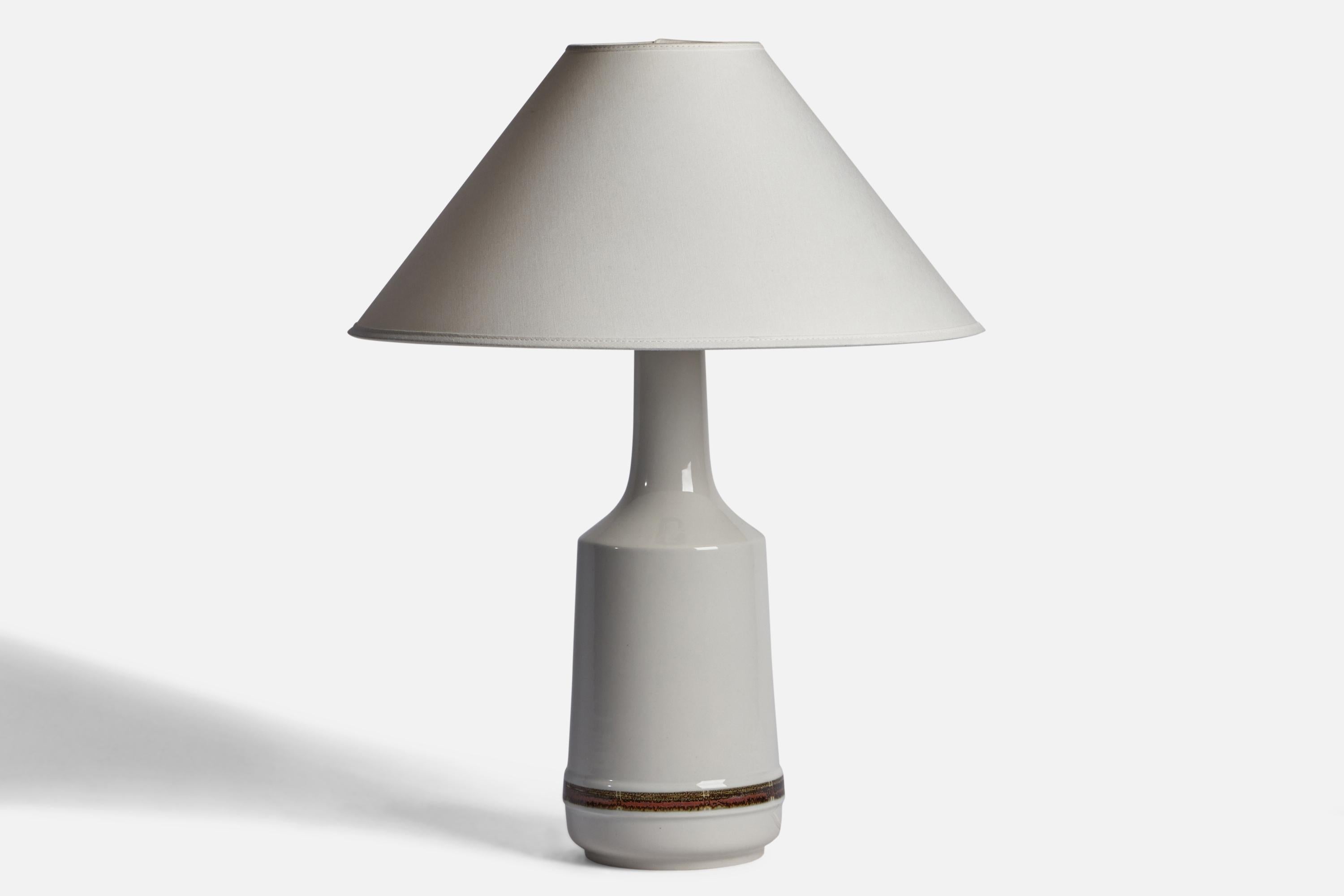 A white-glazed stoneware table lamp designed and produced by Desiree, Denmark, 1960s.

Dimensions of Lamp (inches): 16.25” H x 6” Diameter
Dimensions of Shade (inches): 4.5” Top Diameter x 16” Bottom Diameter x 7.25” H
Dimensions of Lamp with Shade