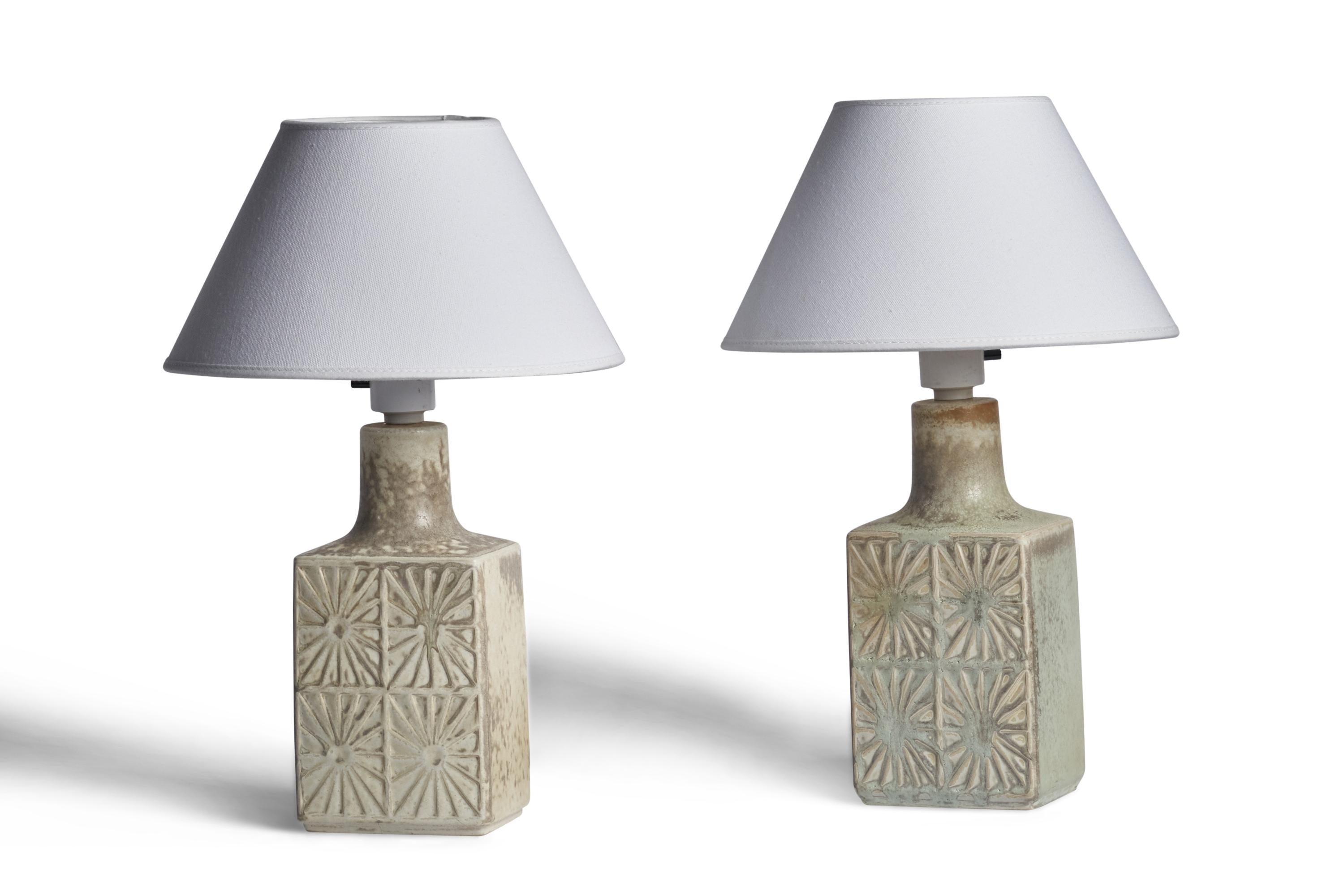 A pair of light-grey glazed table lamps designed and produced by Desiree, Denmark, 1960s.

Dimensions of Lamp (inches): 11.25