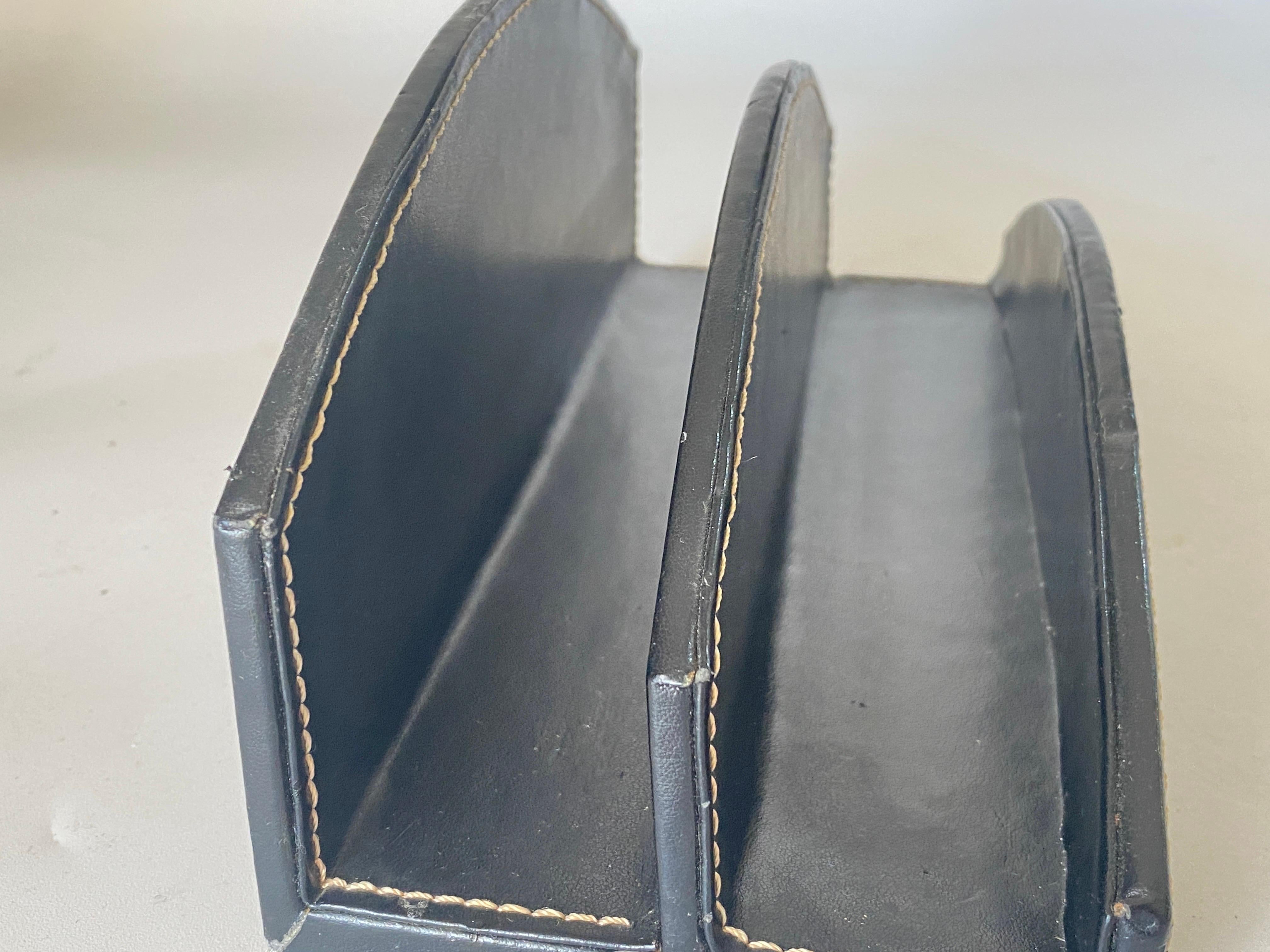 Handsome saddle leather letter holder by Jacques Adnet. Signature contrast stitching. Great patina to leather. Excellent vintage condition. Paris, in the traditions of French big houses like Lancel or Dior.