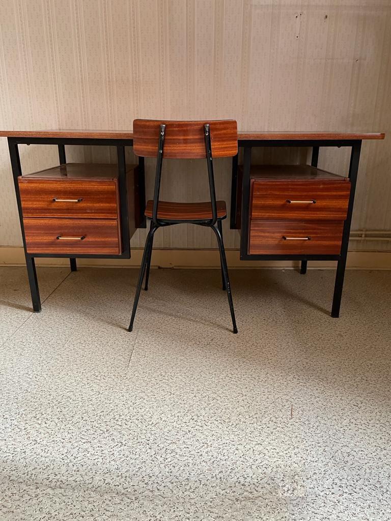 A formica desk and chair, circa 1960.