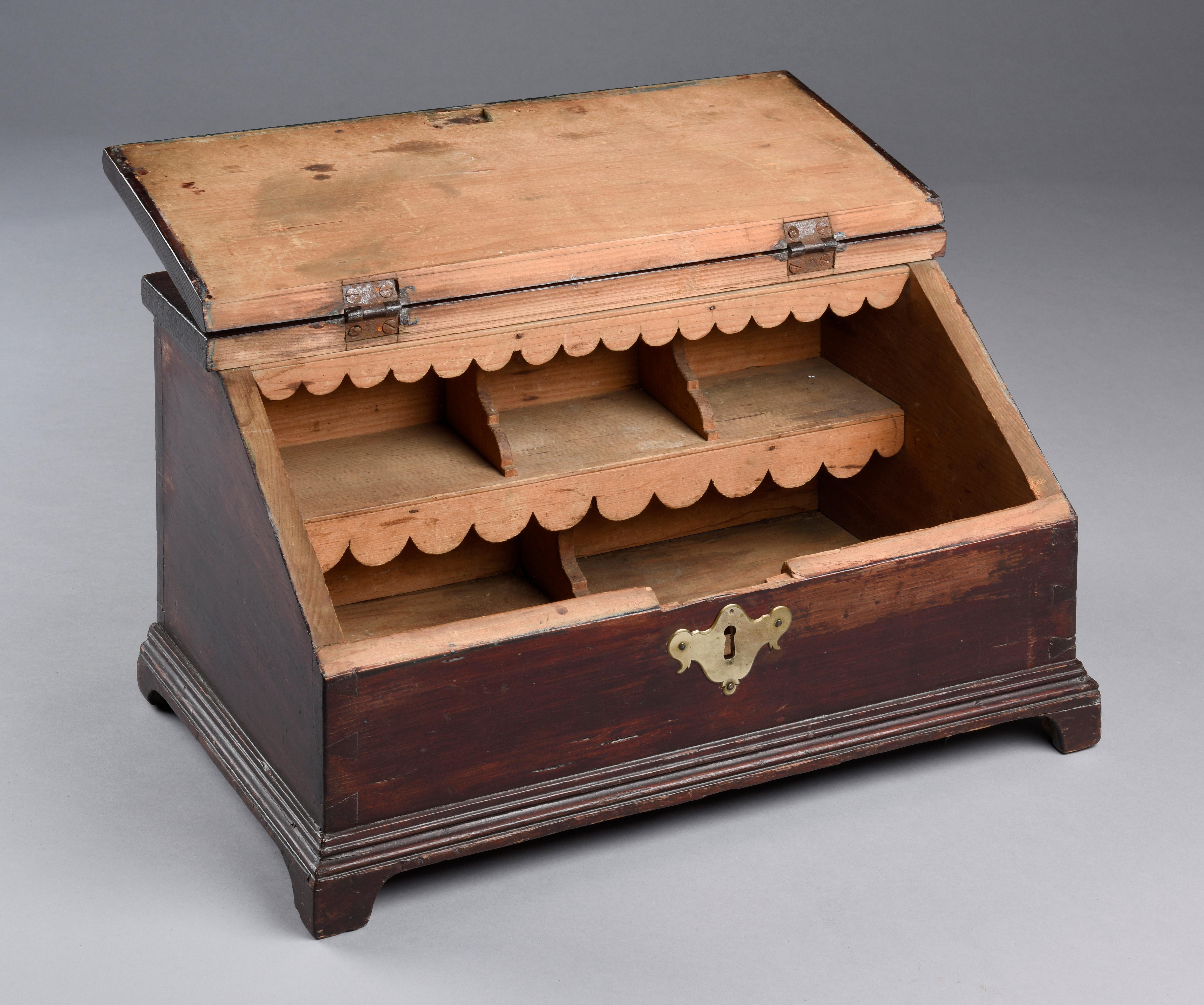Queen Anne desk box with scalloped interior on bracket feet. Made of pine with old mahogany finish. Probably New York.