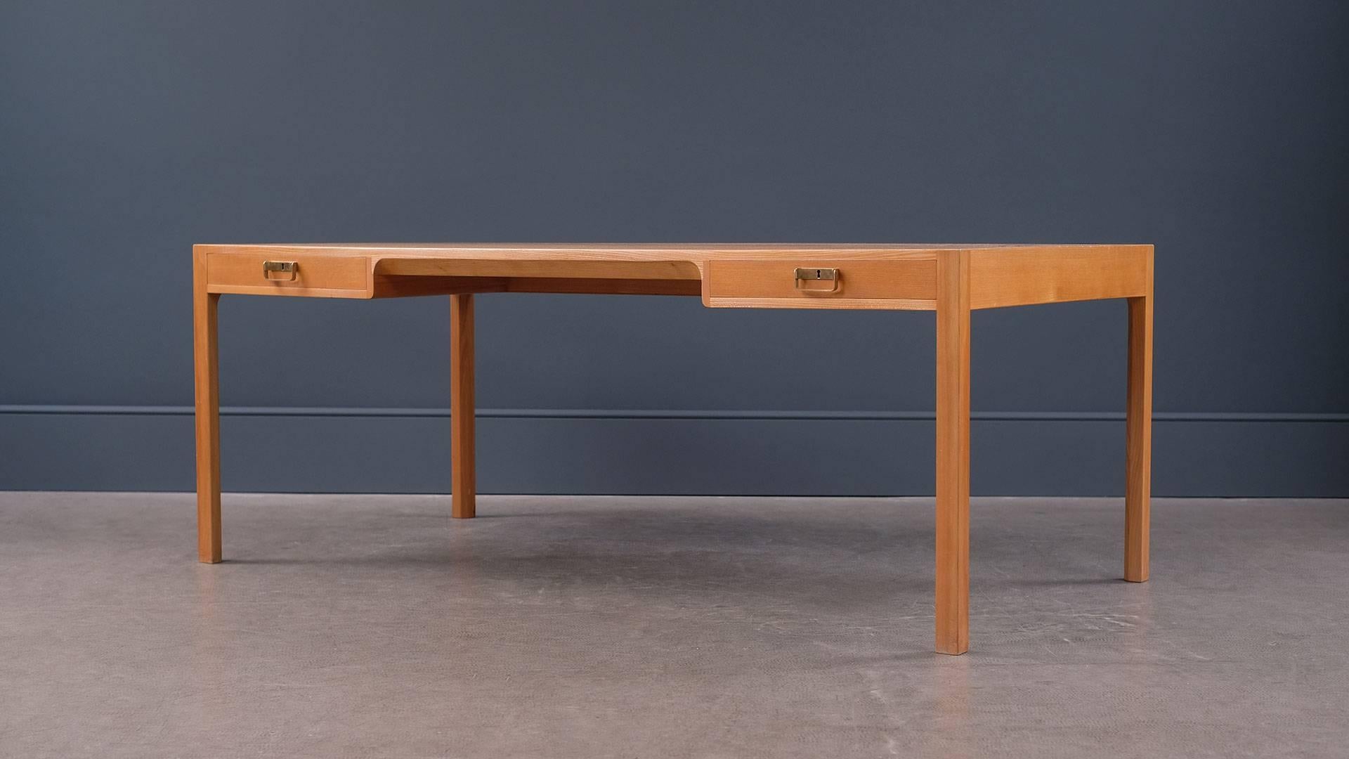 Ultra elegant and high quality large desk in stunning elmwood with brass handles designed by Bernt Petersen for C. N, Jørgensen Møbelsnedkeri, 1964 Denmark.
