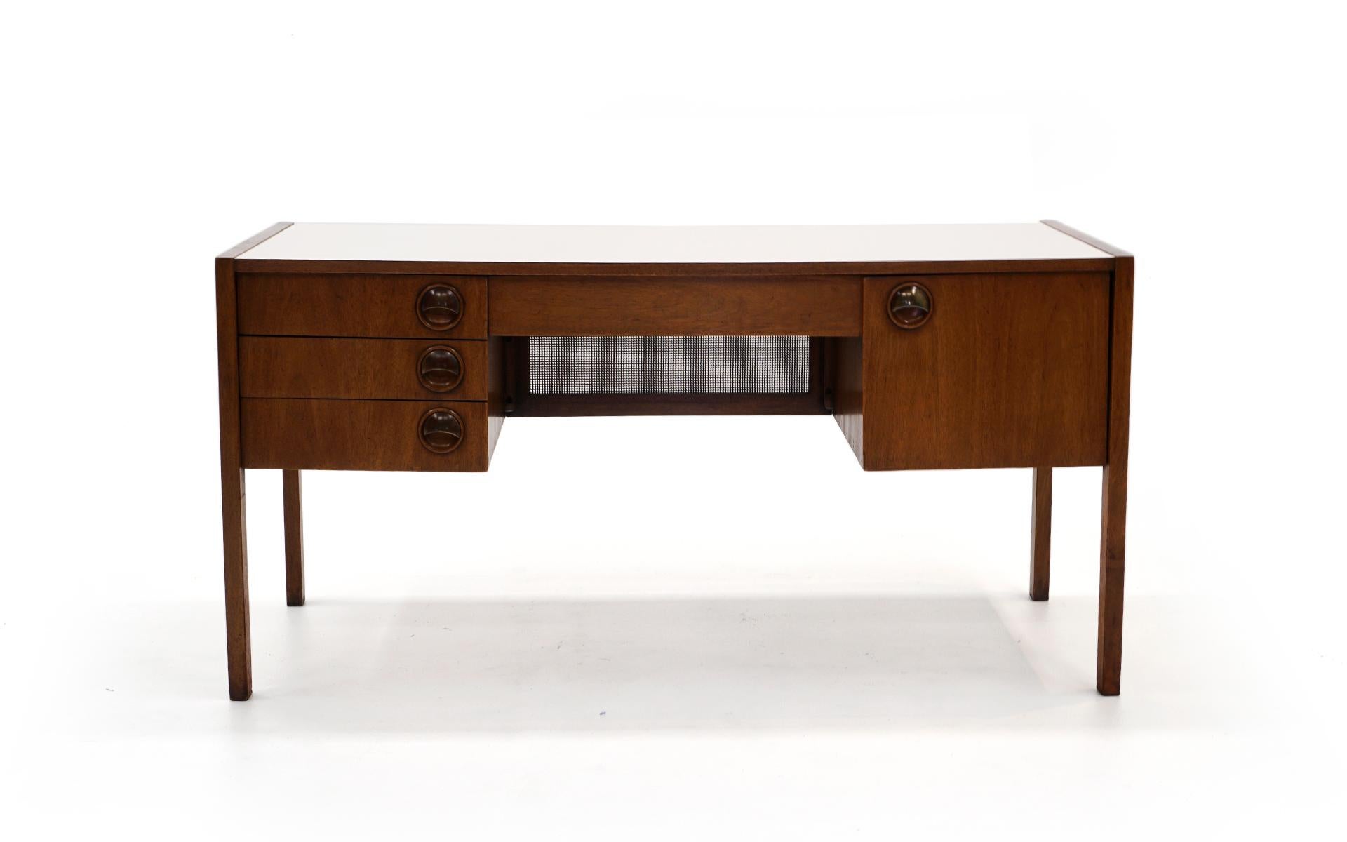 Medium / small size desk designed by Edward Wormley, made by Dunbar, 1960s. Mahogany case and white laminate top. This piece is in original condition and shows some signs of wear but nothing distracting. Ready to use. Measures: 58