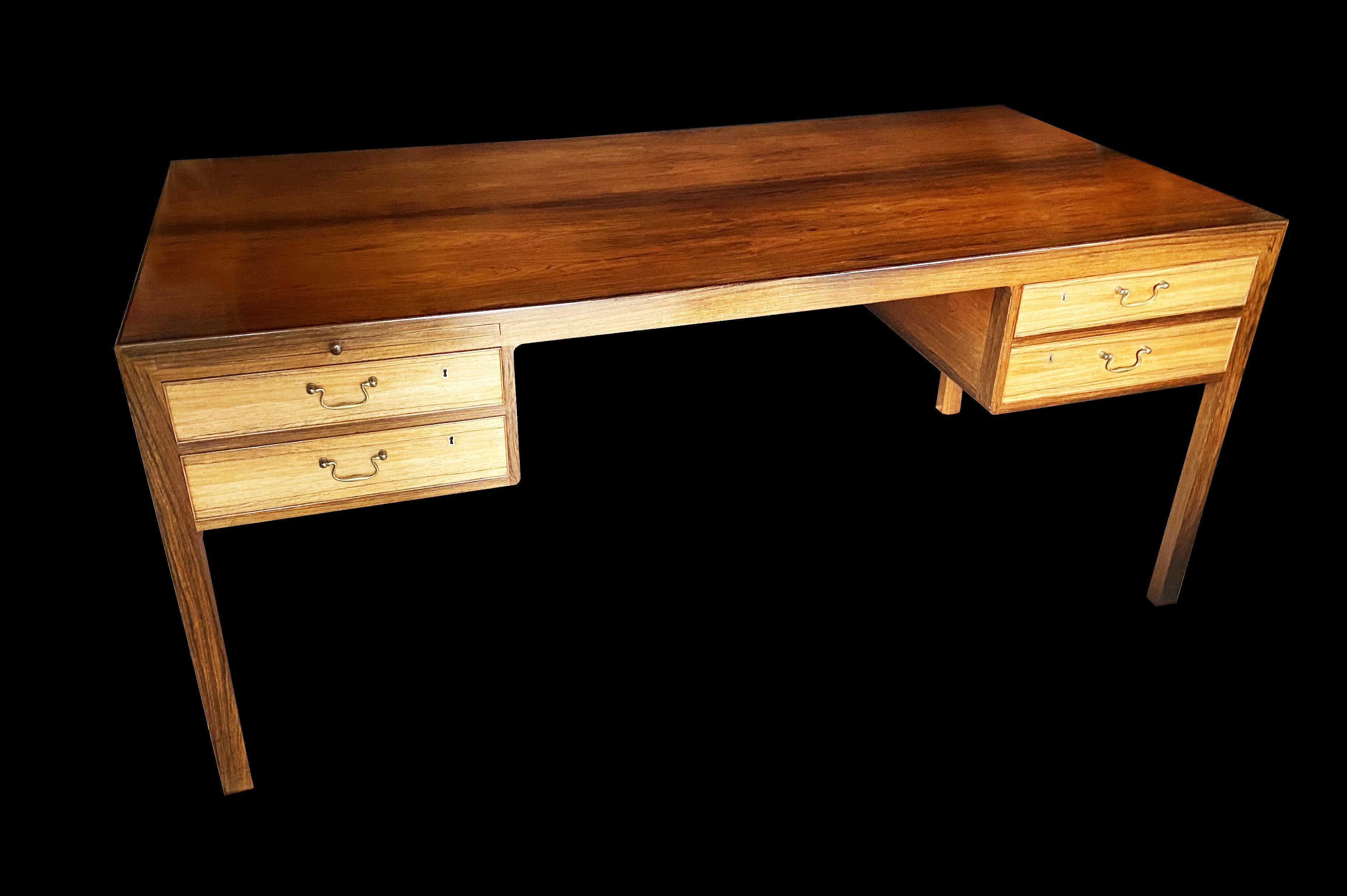 This very rare desk was used by designer Poul Cadovious at his home for many years, and is in very nice condition. We do have the provenance for this piece, which will go along with it when it is sold. 
Fortunately it is made using Santos rosewood,