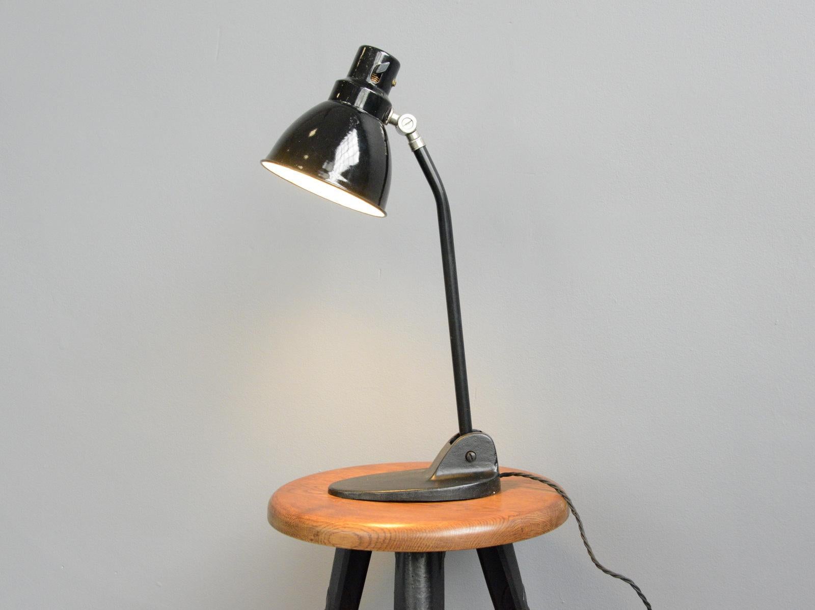 Desk by Pieter Oud for Jacobus, circa 1930s

- Vitreous stepped black enamel shade
- Original Bakelite toggle On/Off switch
- Cast iron base
- Adjustable arm and shade
- Takes E27 fitting bulbs
- Designed by Dutch designer Pieter Oud
-