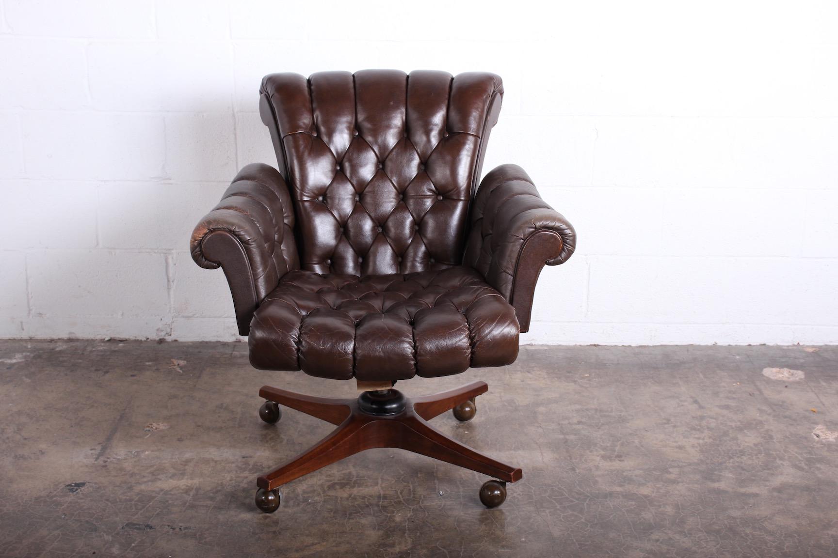 A leather desk chair designed by Edward Wormley for Dunbar. Adjustable height and tilting back.