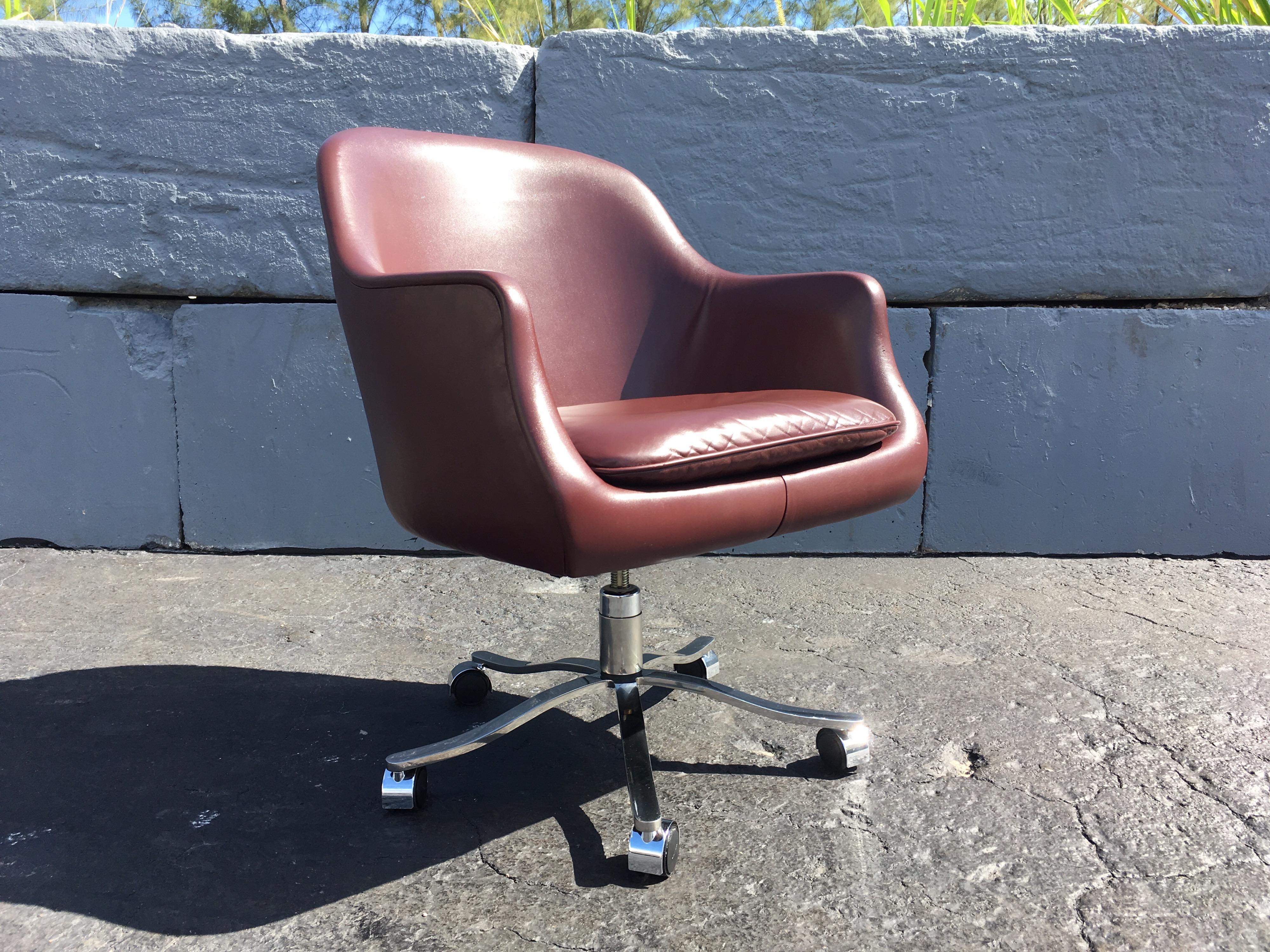 Desk chair by Nicos Zographos, leather, stainless steel base, tilts, swivels, adjustable seat height is 21.50”-17.50”.