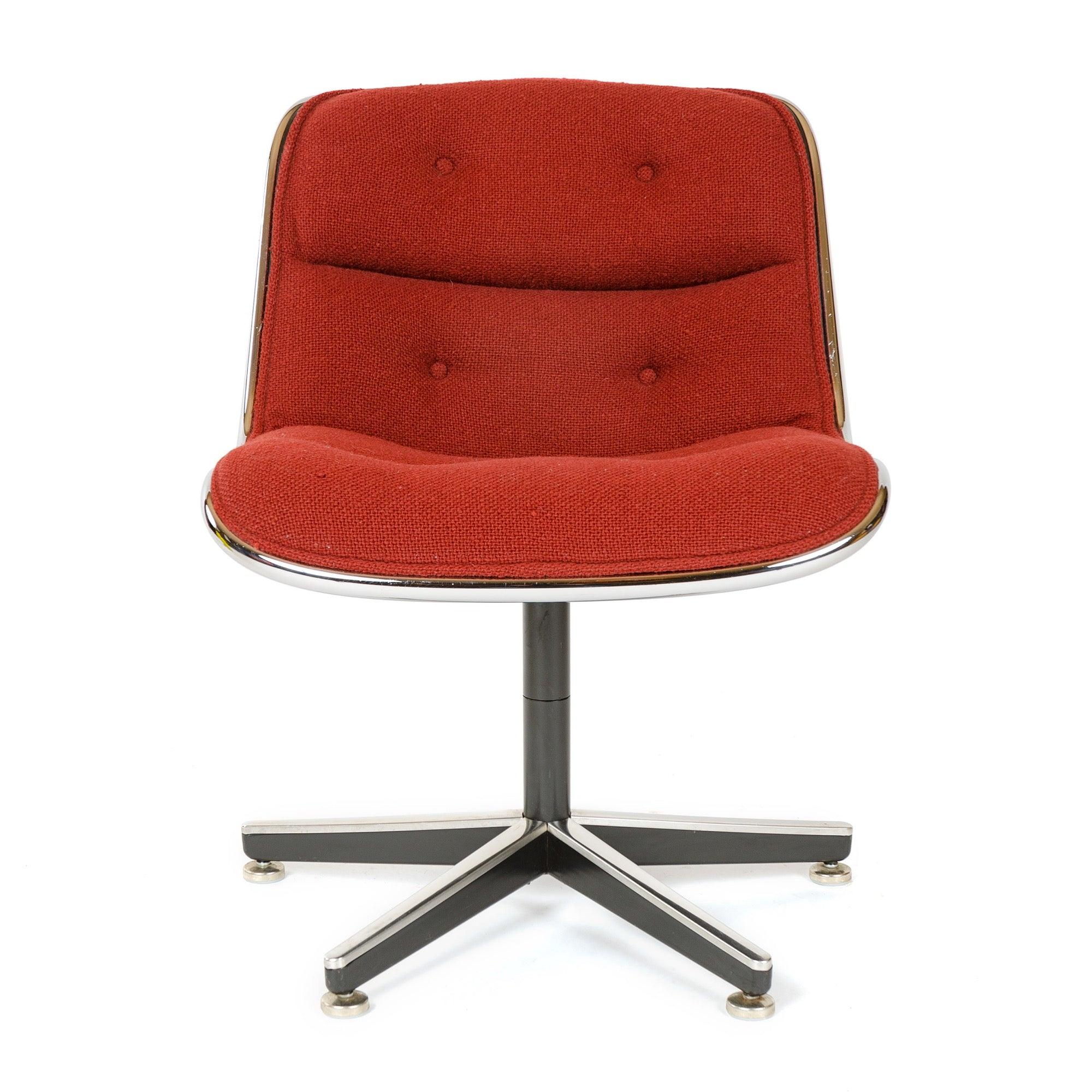 A vintage Pollack Executive Chair on five leg pedestal base featuring his â€˜rim technology' of metal edge banding around the chair's periphery separating hard shell frame from original Knoll red wool upholstery.