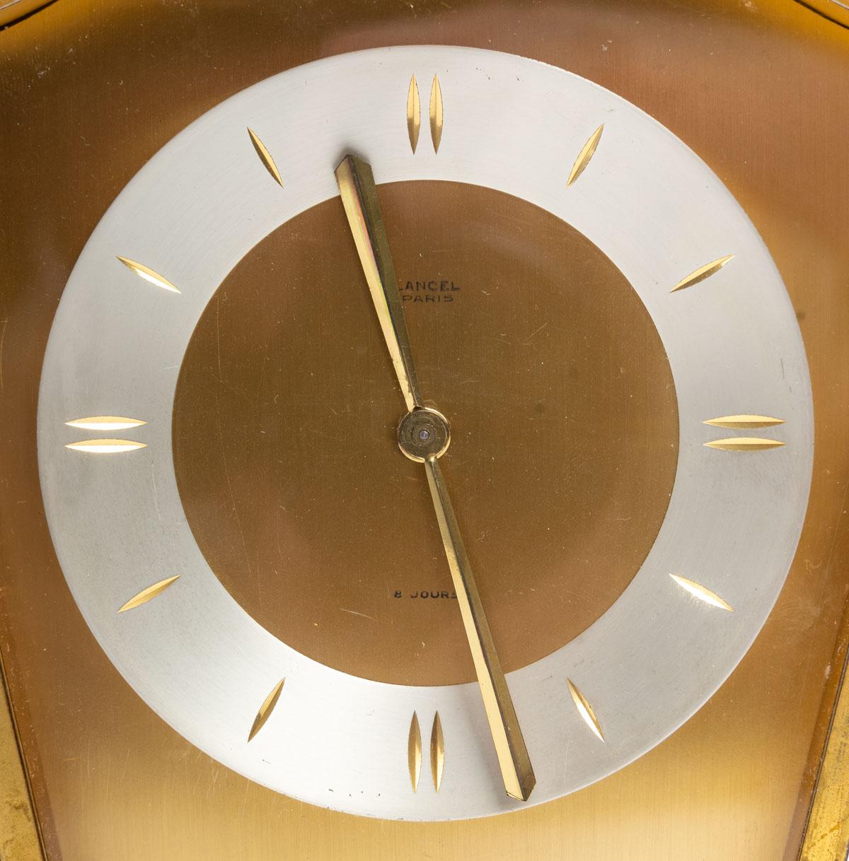 Desk clock of the LANCEL Paris brand from the 1940s, gilt bronze, used and patinated with gilding.
H: 22 cm, W: 17 cm, D: 7.5 cm