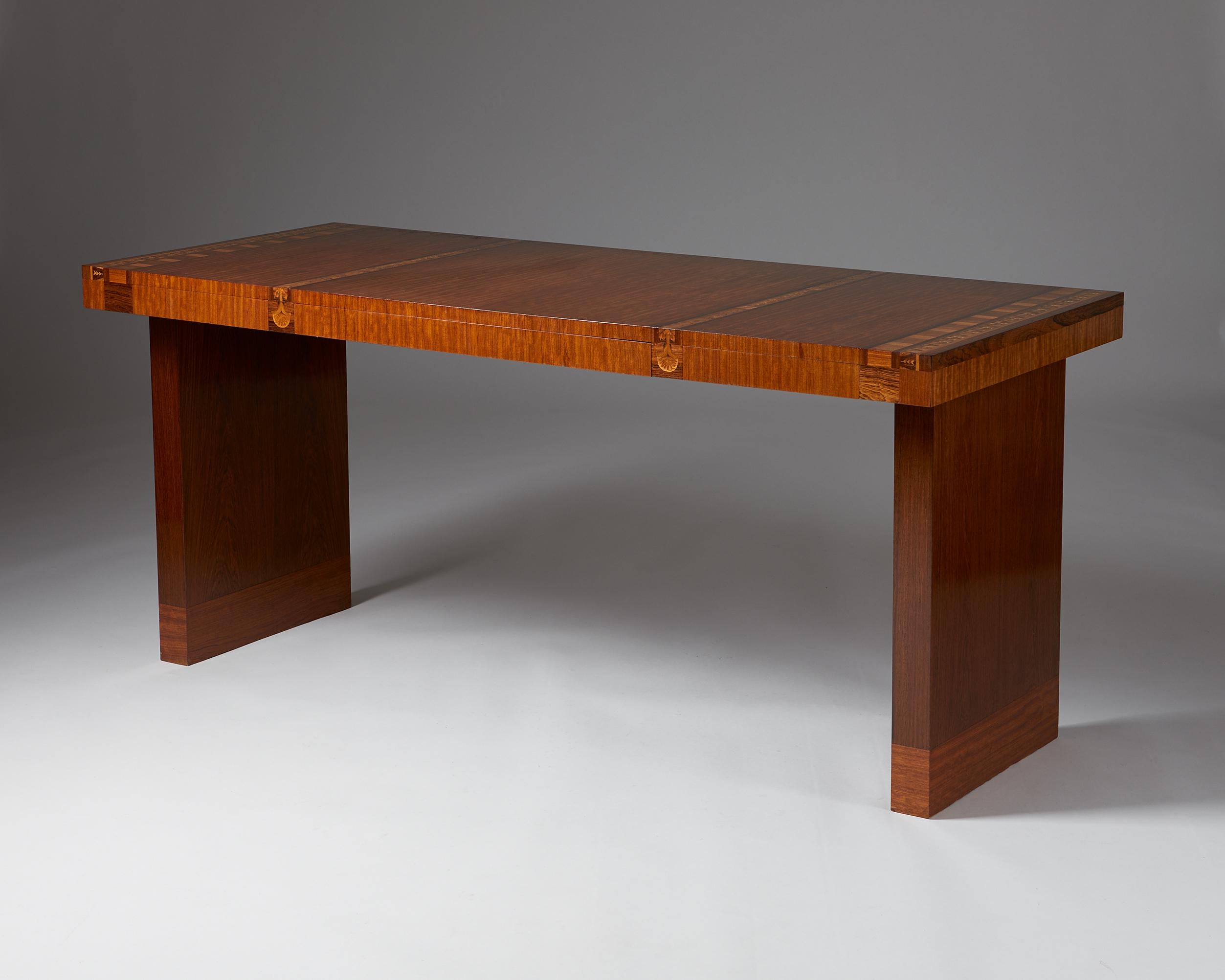 Desk designed by Carl Malmsten, Sweden, 1934.

Mahogany with inlays of walnut. 

Unique. Signed C.Malmsten.

This mahogany desk by Carl Malmsten from 1934 has simple lines and exquisite inlays of walnut. Signed and dated by Malmsten himself on the