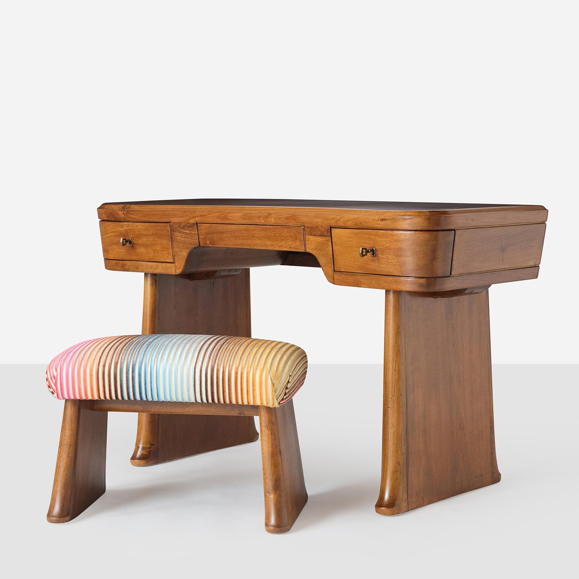 A beautiful desk-dressing table and stool set by Vittorio Valabrega, circa 1930s. Crafted from rich walnut and carefully restored, revealing the natural warmth and grain of the wood, this piece features a center drawer and two lockable side drawers.