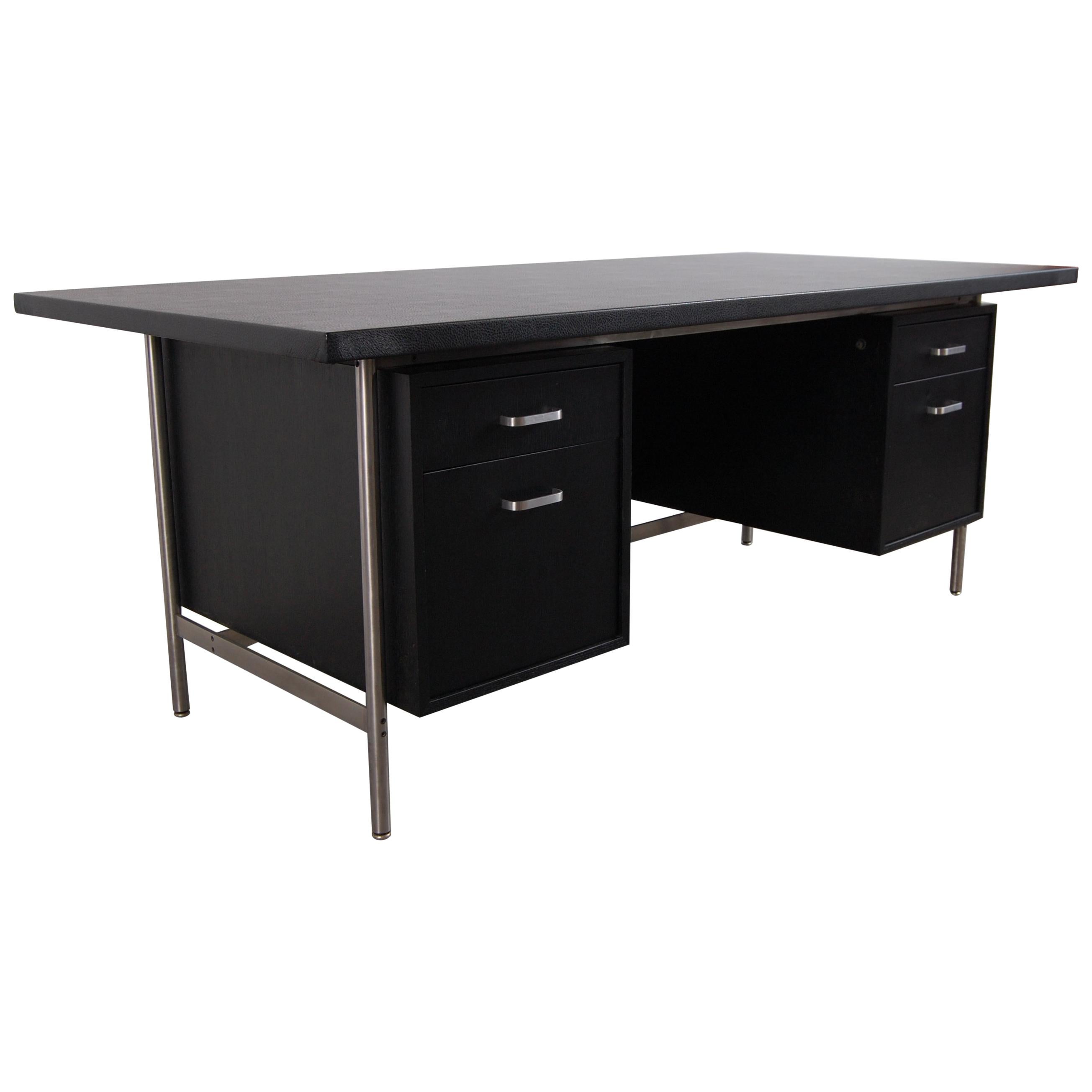 Desk in ebonized oak and stainless steel, circa 1959. This desk came out of the Mies van der Rohe designed Seagram Building, at 375 Park Avenue, in New York City. Although the designer of the desk is unclear, the furnishings for building, including