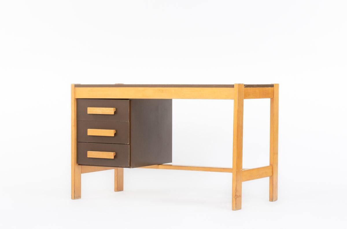 Desk by Andre Sornay in the fifties
Structure in patinated beech with brown laminate top and side panels
3 drawers in front
traces of time on the wood and top.