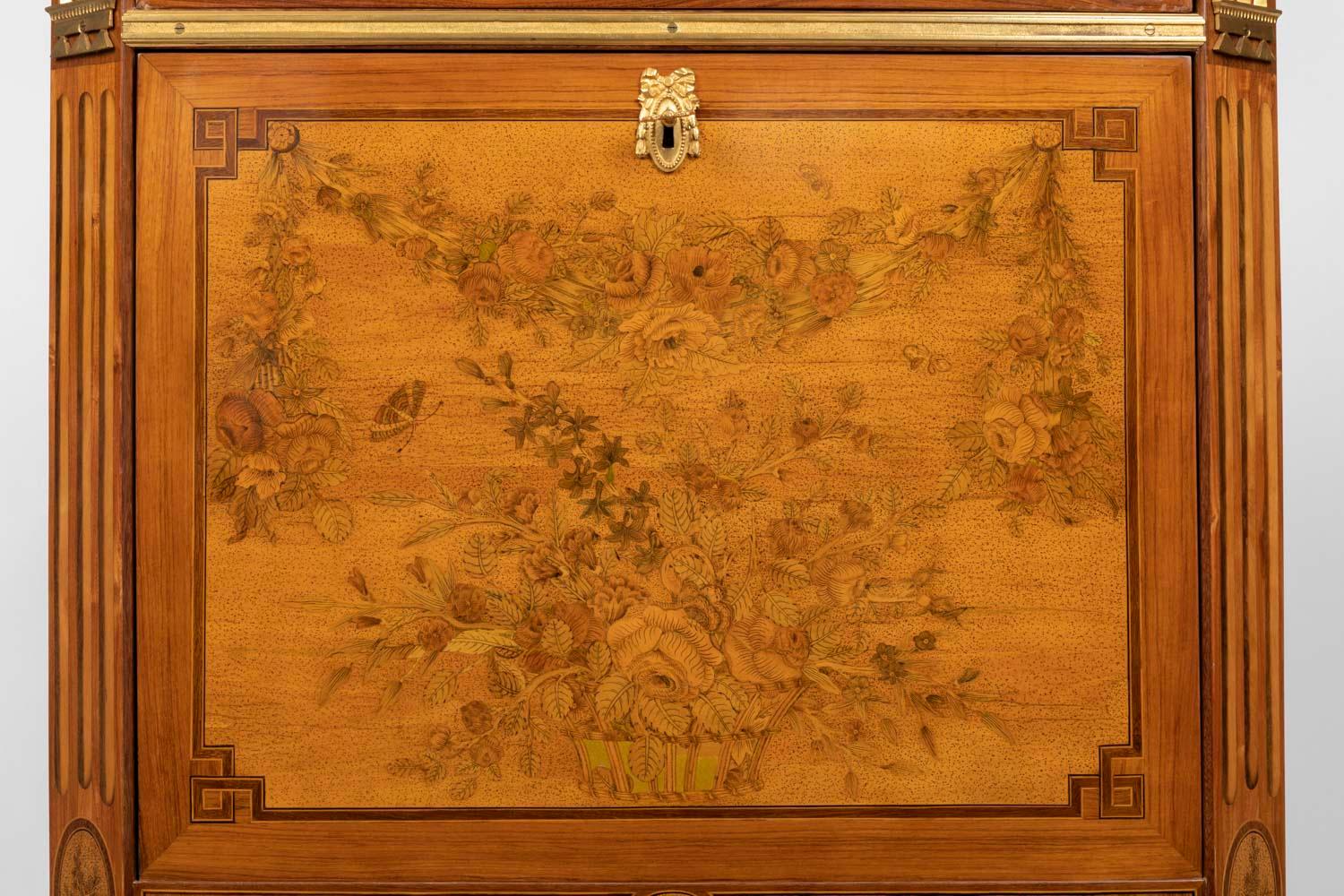 Desk with flaps in Louis XVI period flower marquetry stamped C. Topino and JME (on the rear right upright) opening to a border drawer surmounting a flap revealing six small drawers and four lockers and two doors at the bottom hiding two drawers; a