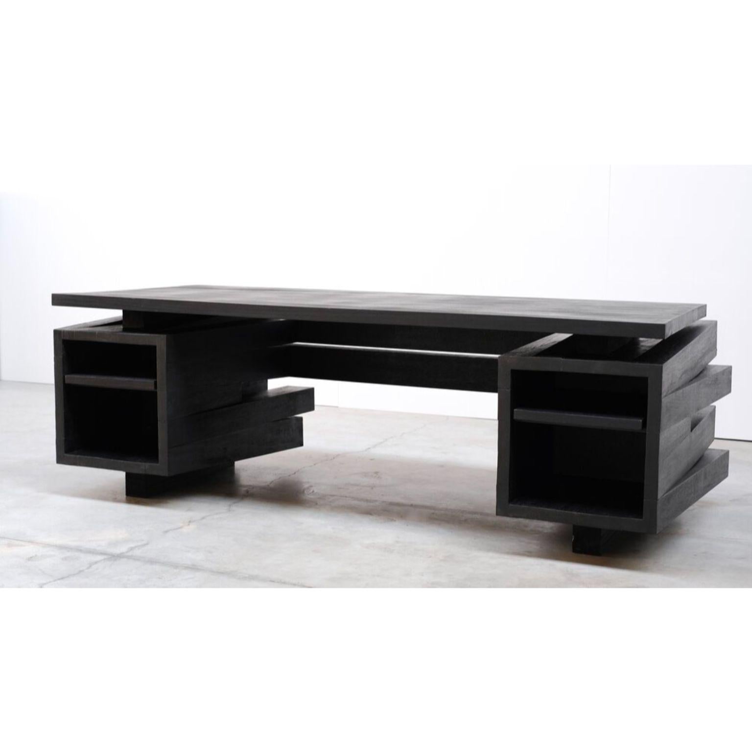 Desk in iroko wood by Arno Declercq
Edition of 12 pieces
Dimensions: W 233 x D 100 x H 75 cm 
Materials: Burned and waxed iroko wood

Arno Declercq
Belgian designer and art dealer who makes bespoke objects with passion for design, atmosphere,