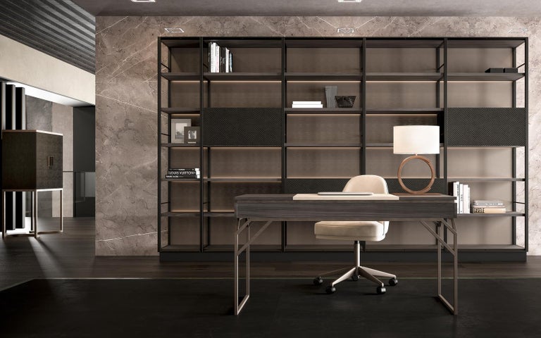 A highly functional and clean design characterize this desk featuring soft leather, an exotic style wood top and a sturdy metal base. Perfect for sitting down at to tend to your writing or organizational needs, whether in an office or personal