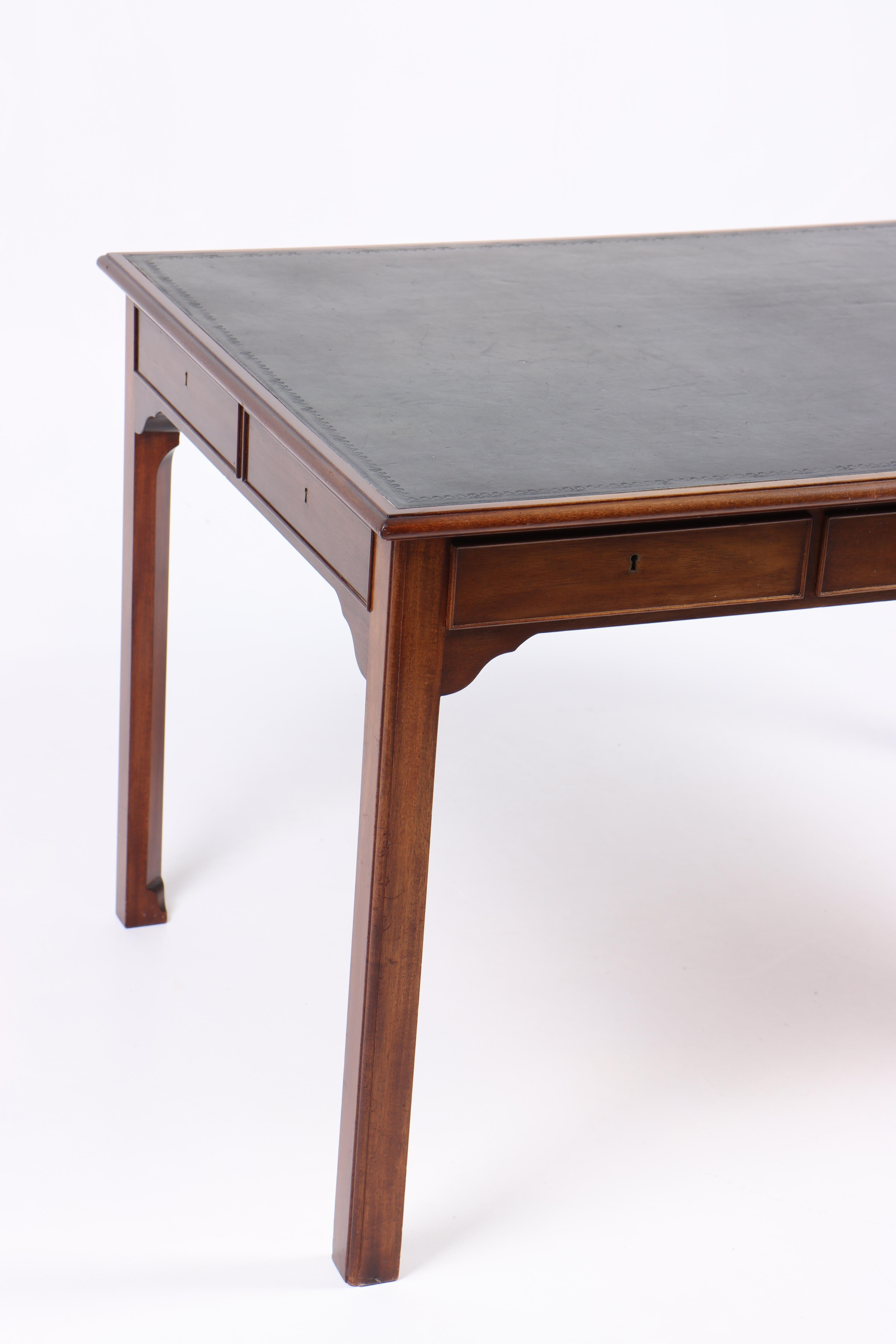 Desk in mahogany and patinated leather. Designed and made in Denmark. Great original condition.

