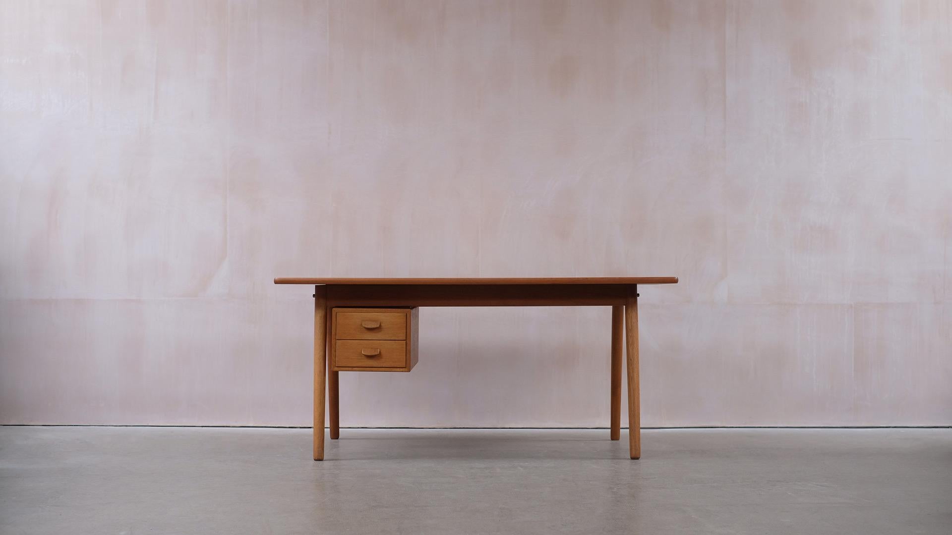 Fantastic and rare desk with oak legs and a contrasting teak top designed by Poul Volther for FBD, Denmark 1958. Great looking and high quality piece of classic Danish design.