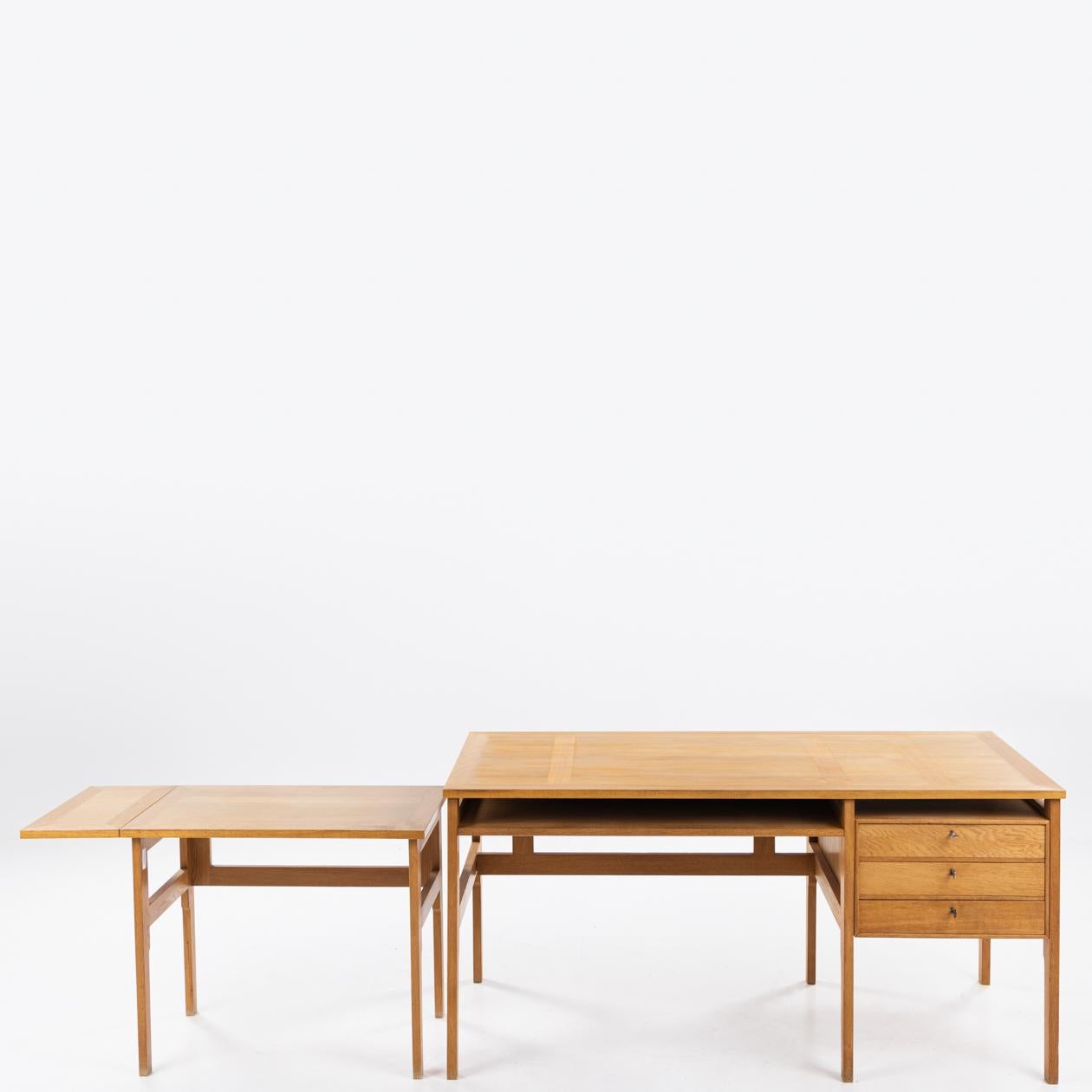 Desk in oak with a three-drawer drawer cassette and side table by Mogens Koch / Rud. Rasmussen.