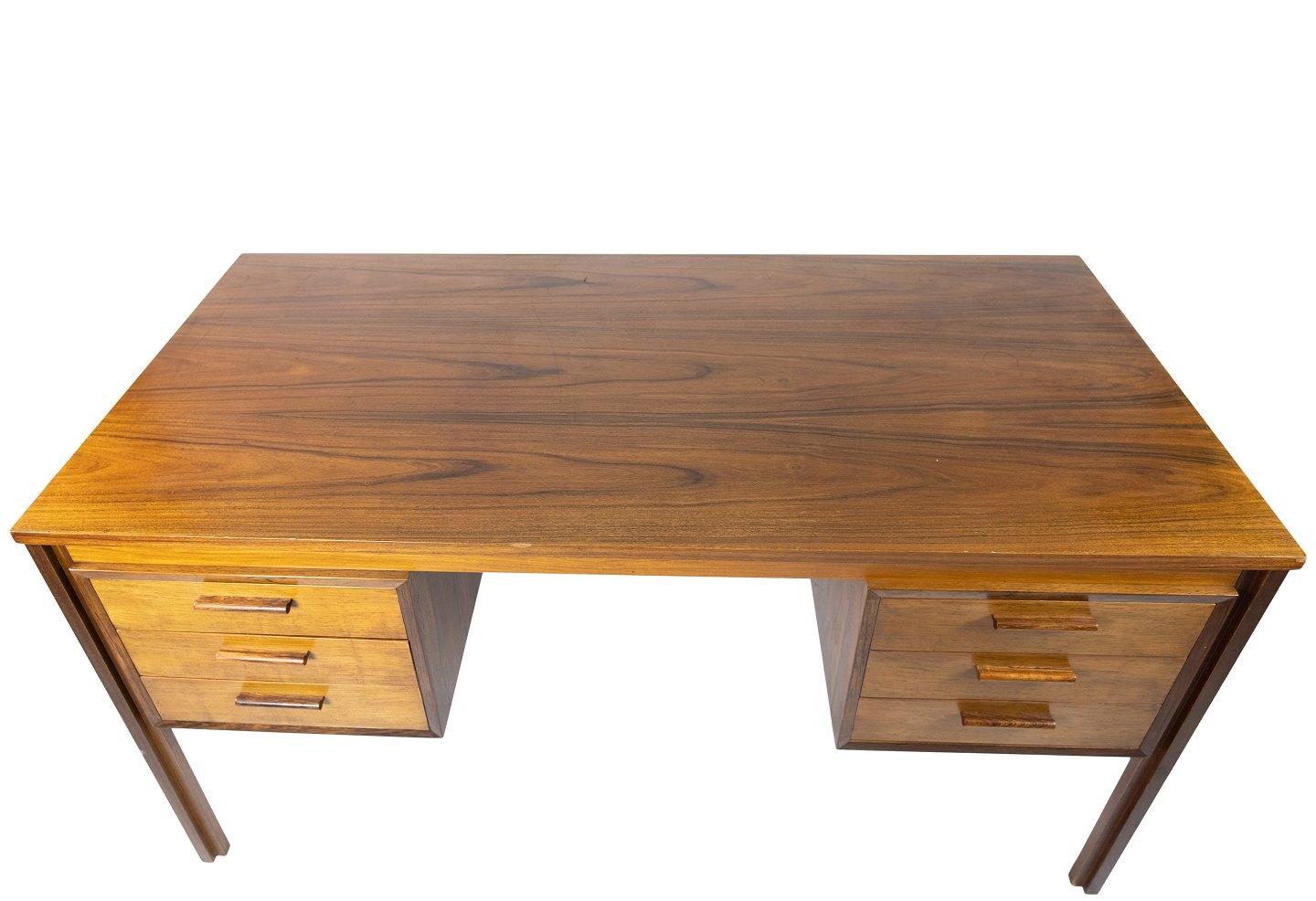 Desk in rosewood of danish design from the 1960s. The table is in great vintage condition.
 