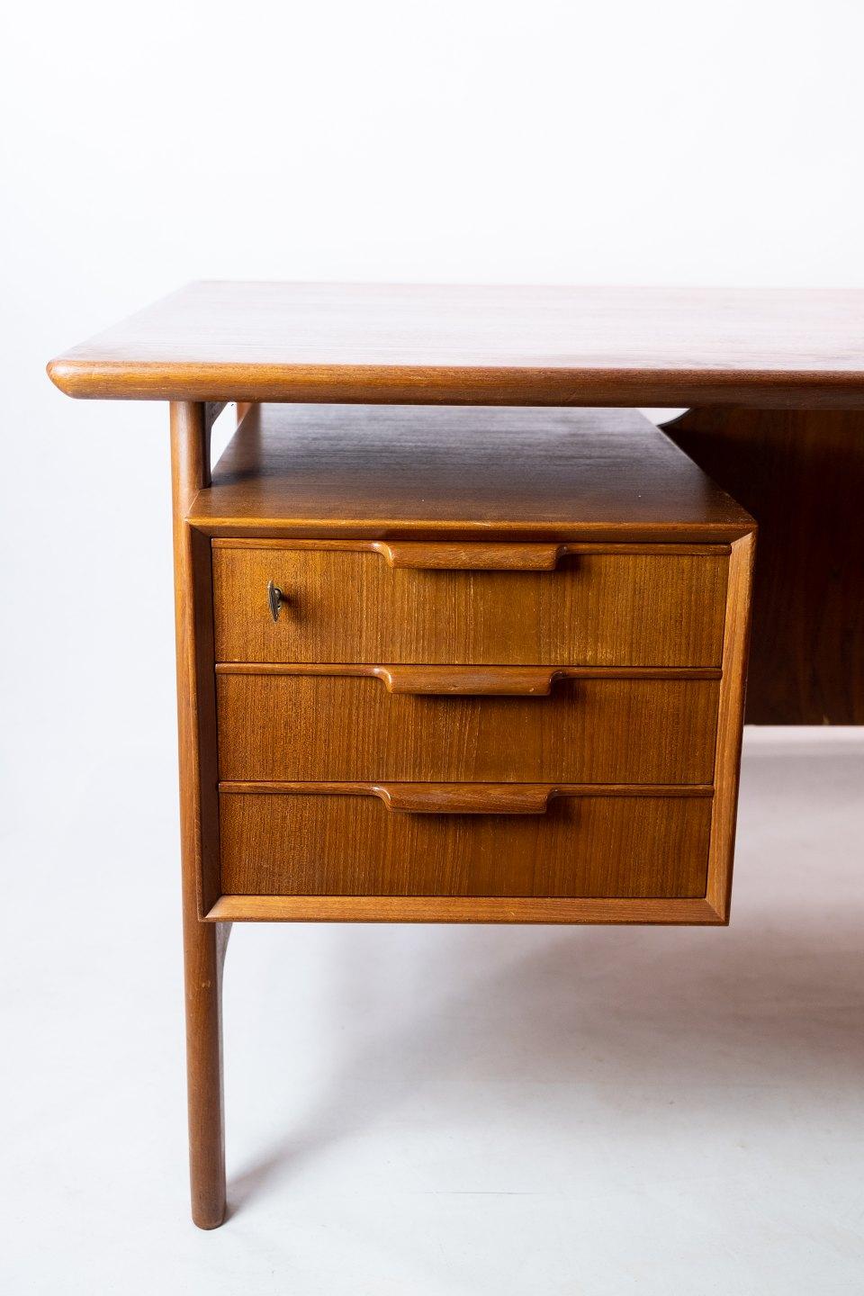 Desk in teak designed by Omann Junior from the 1960s. The table is in great vintage condition.