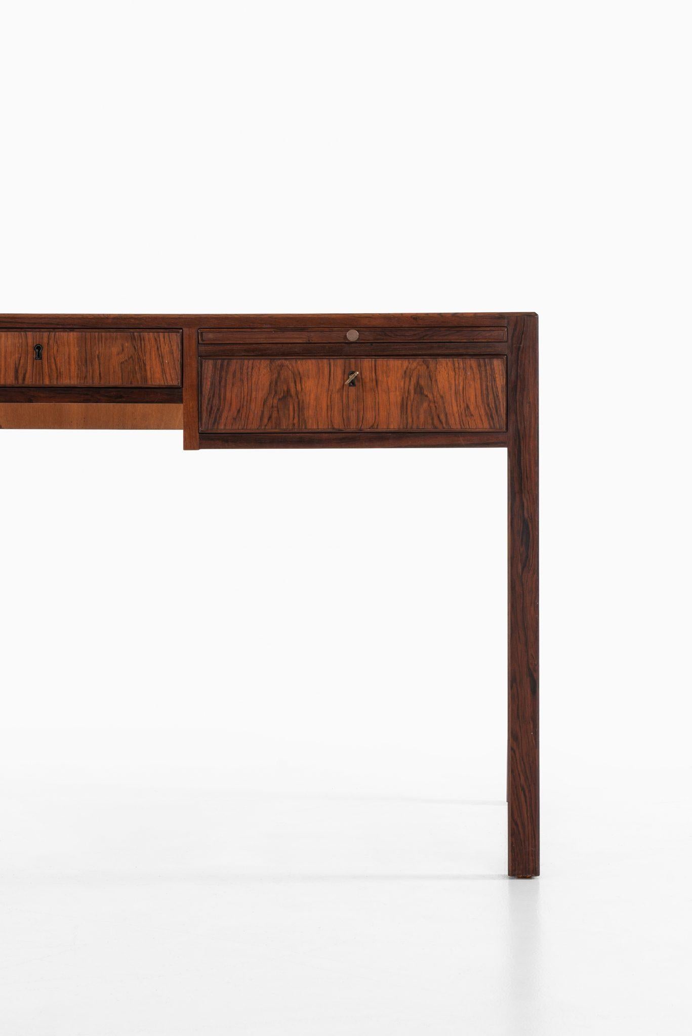 Rare freestanding desk in the manner of Ole Wanscher. Produced in Denmark.