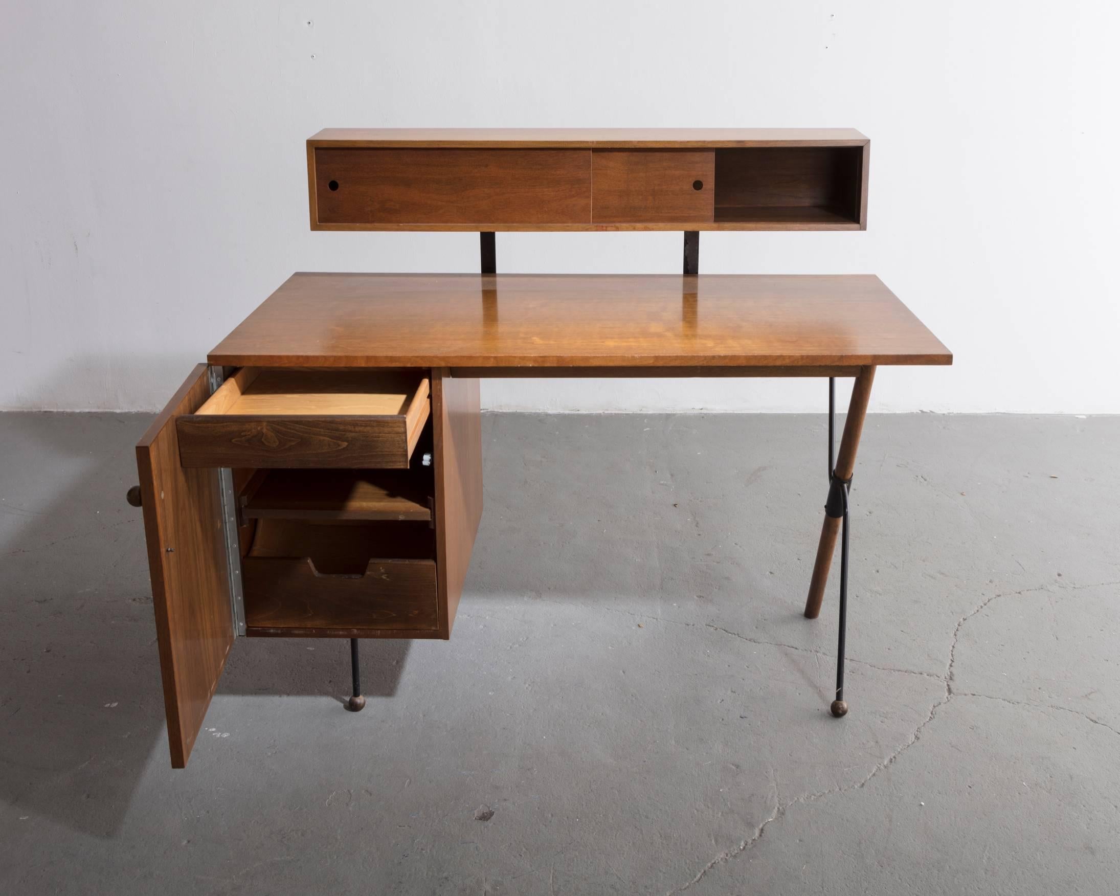 Desk in walnut and iron with pencil box. Designed by Greta Magnusson Grossman for Glenn of California, Los Angeles, California, 1952.