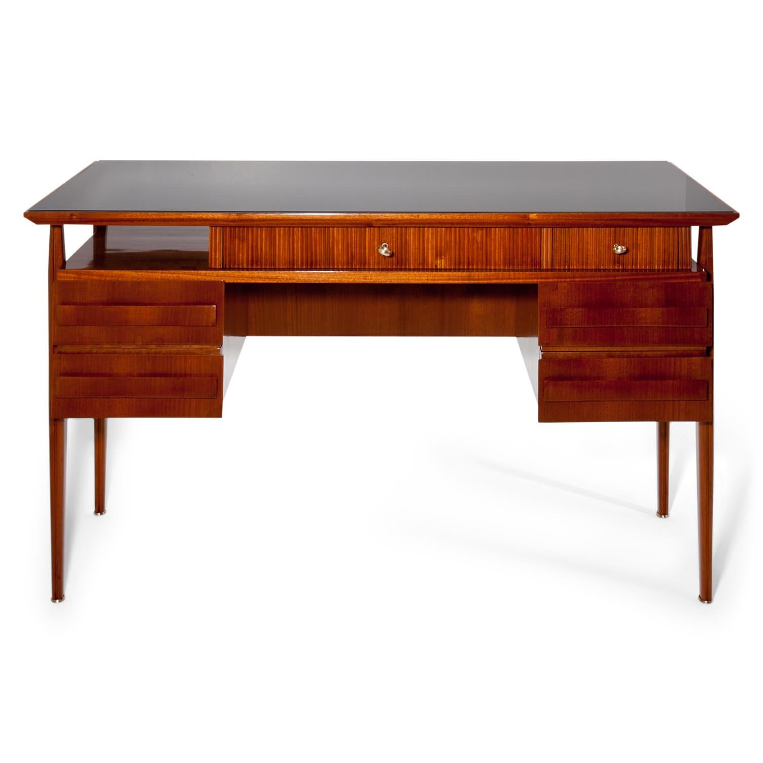 Italian midcentury desk with five drawers and a rectangular black tabletop covered with glass. Very beautiful design, the backside shows a rectangular filling in black and the top drawers are decorated with vertical grooves.