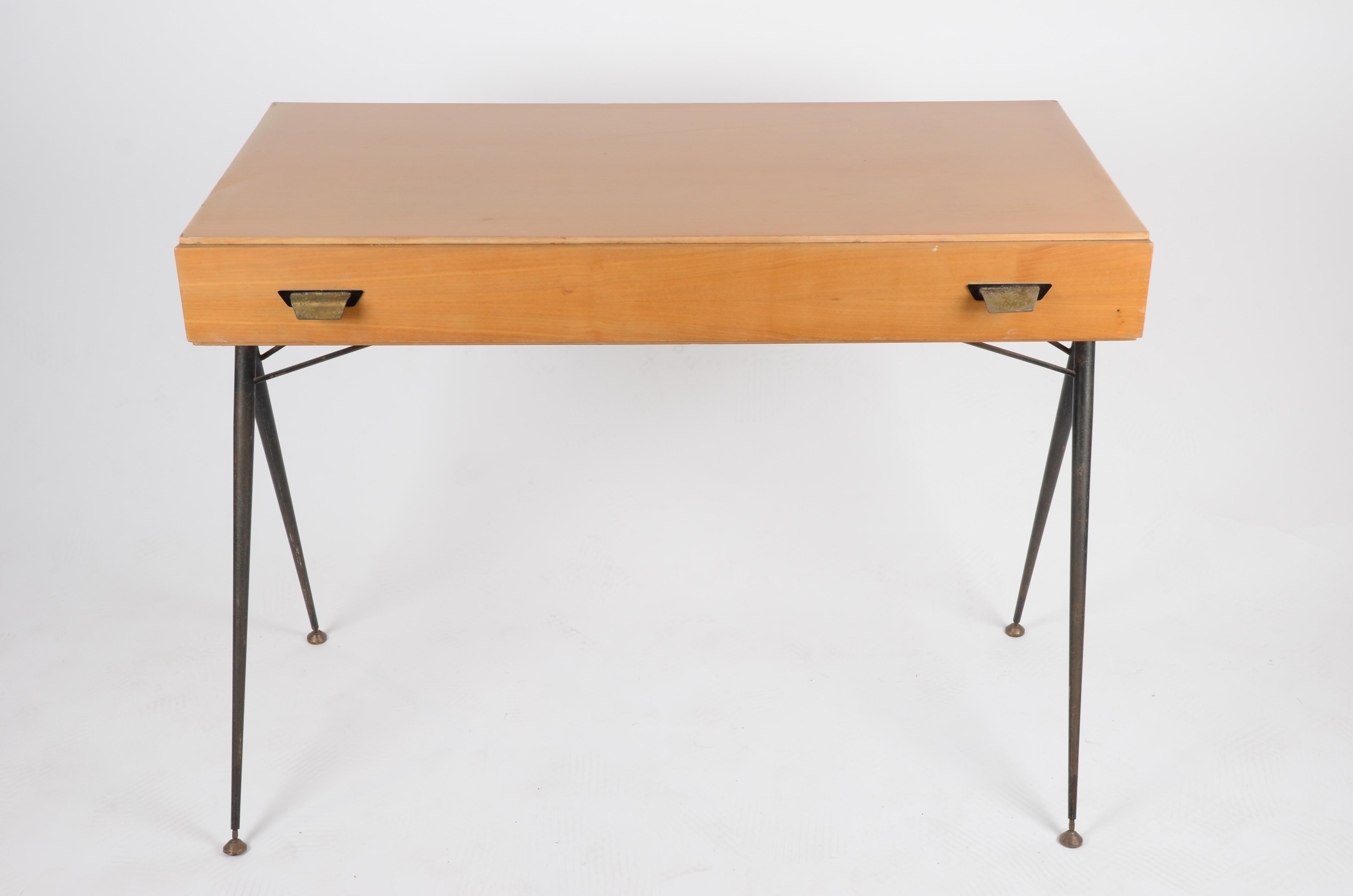 Desk in lacquered metal and wood. 

One drawer, interior with stains.