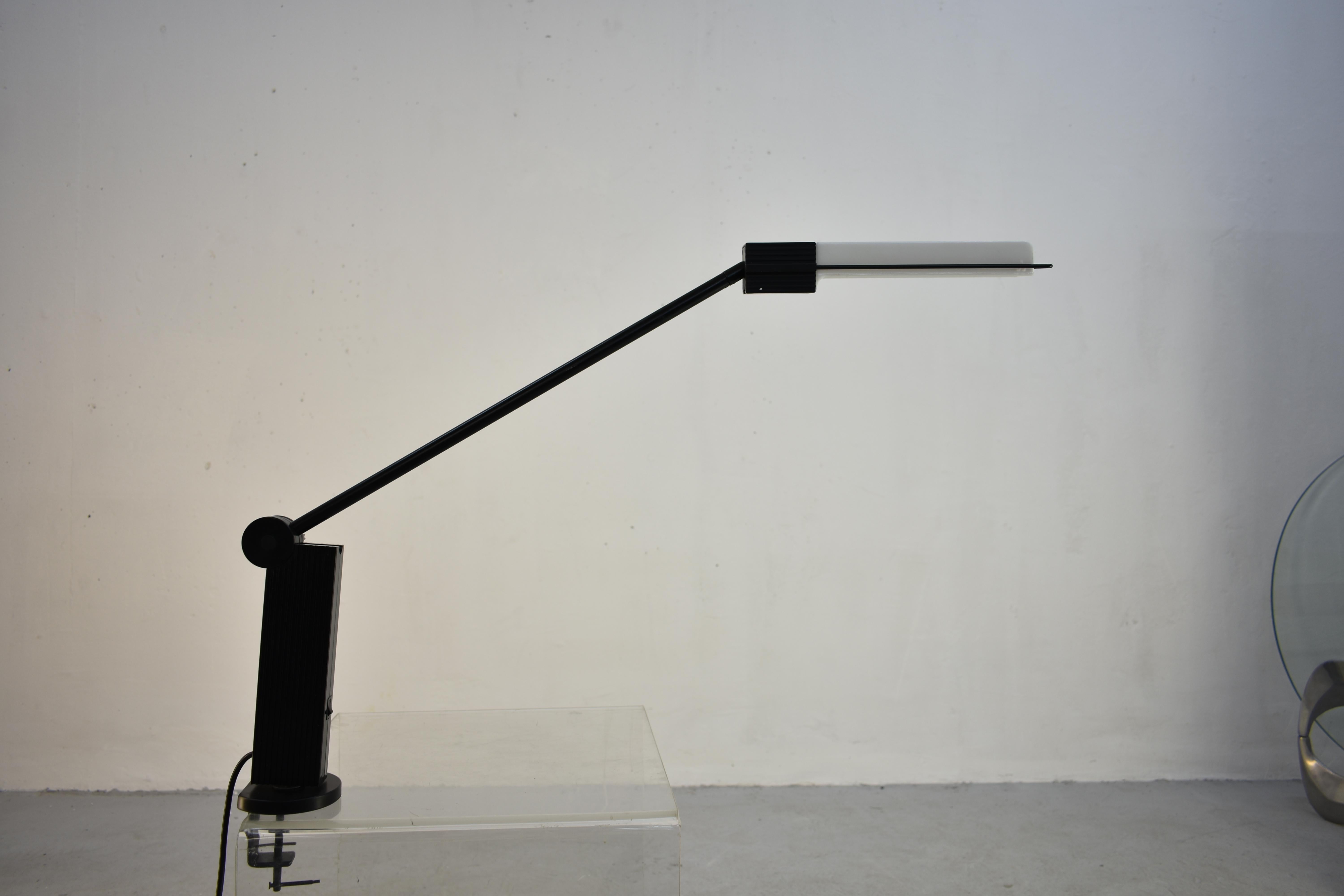 'Alistro' desk lamp by Ernesto Gismondi for Artemide with black body and white acrylic lampshade.

Designed in 1983 and manufactured during the 1980s.

The lamp was never in use and remains in mint condition
