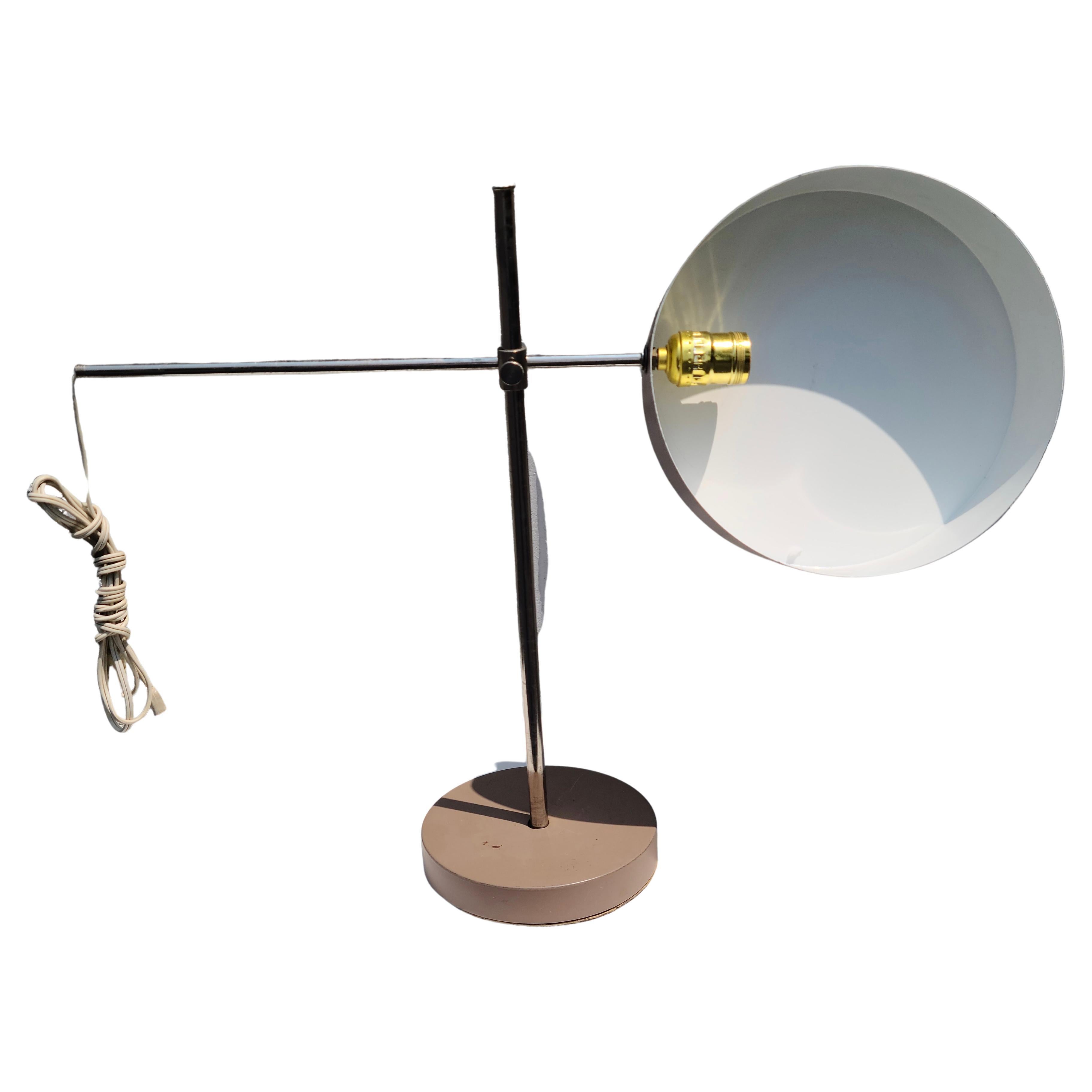 Adjustable Desk Lamp.
In the Style of Anders Pehrson of Atelier Lyktan.
This model is shown in the Cara Greenberg book on Mid Century Modern.