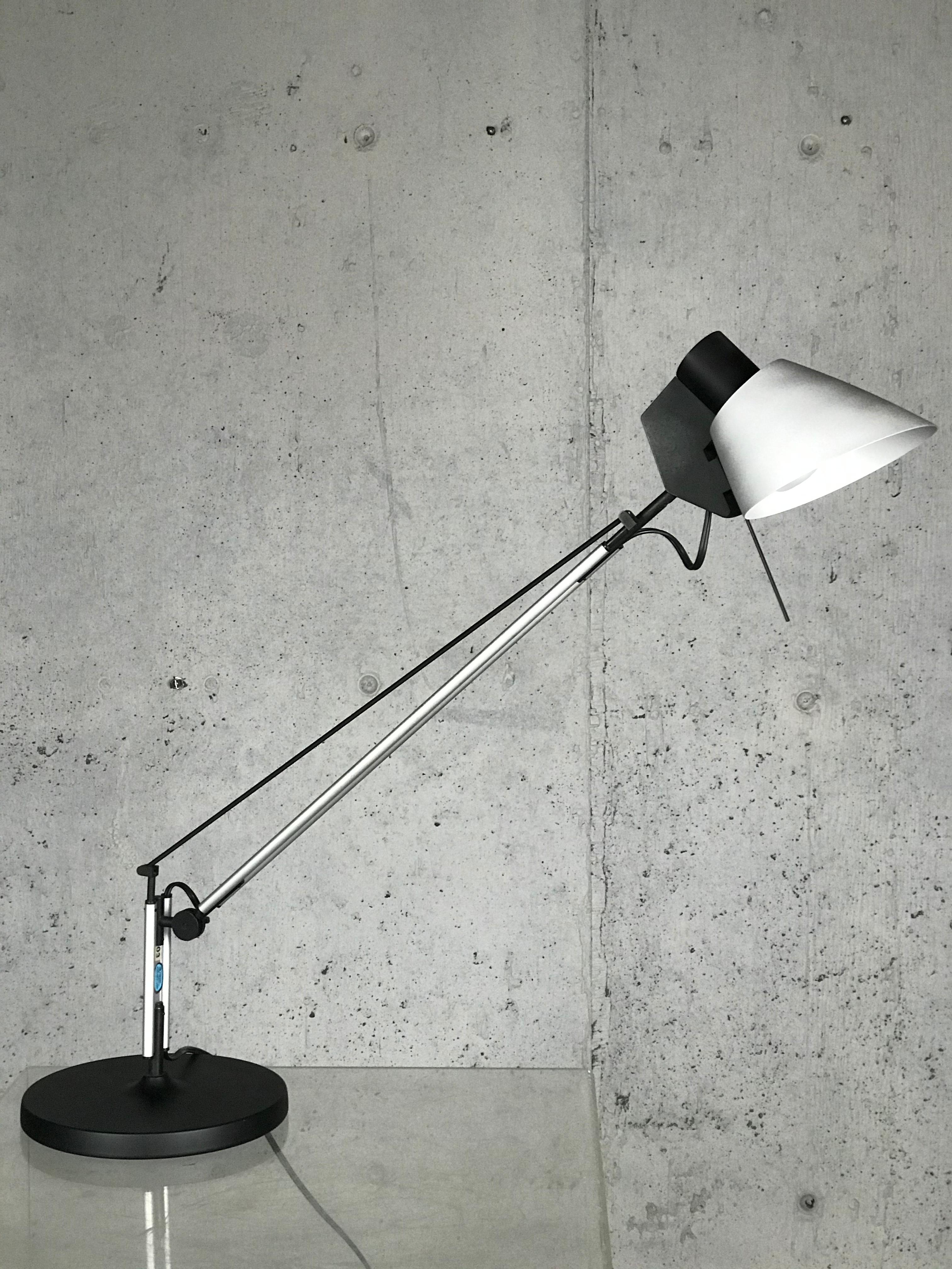 Vintage 1970s-1980s Italian modern architectural Italian desk lamp by Mario Barbaglia & Joe Colombo for Italiana Luce. The lamp articulates in many directions, up and down, side to side, as does the shade and head. Works great. Metal base. Signed