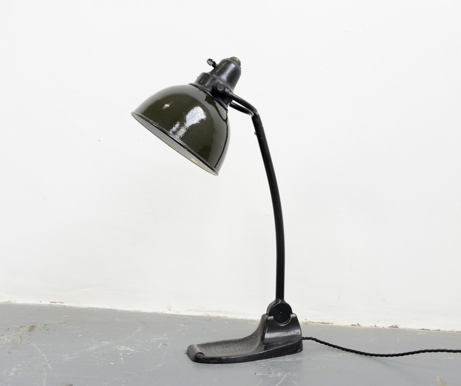 Desk Lamp By Bunte & Remmler, circa 1920s

- Vitreous Olive green shade
- Porcelain On/Off toggle switch
- Cast iron base with ashtray
- Takes E27 bulbs
- Made by Bunte & Remmler, Frankfurt
- German ~ 1920s
- 50cm tall x 20cm deep x 11cm